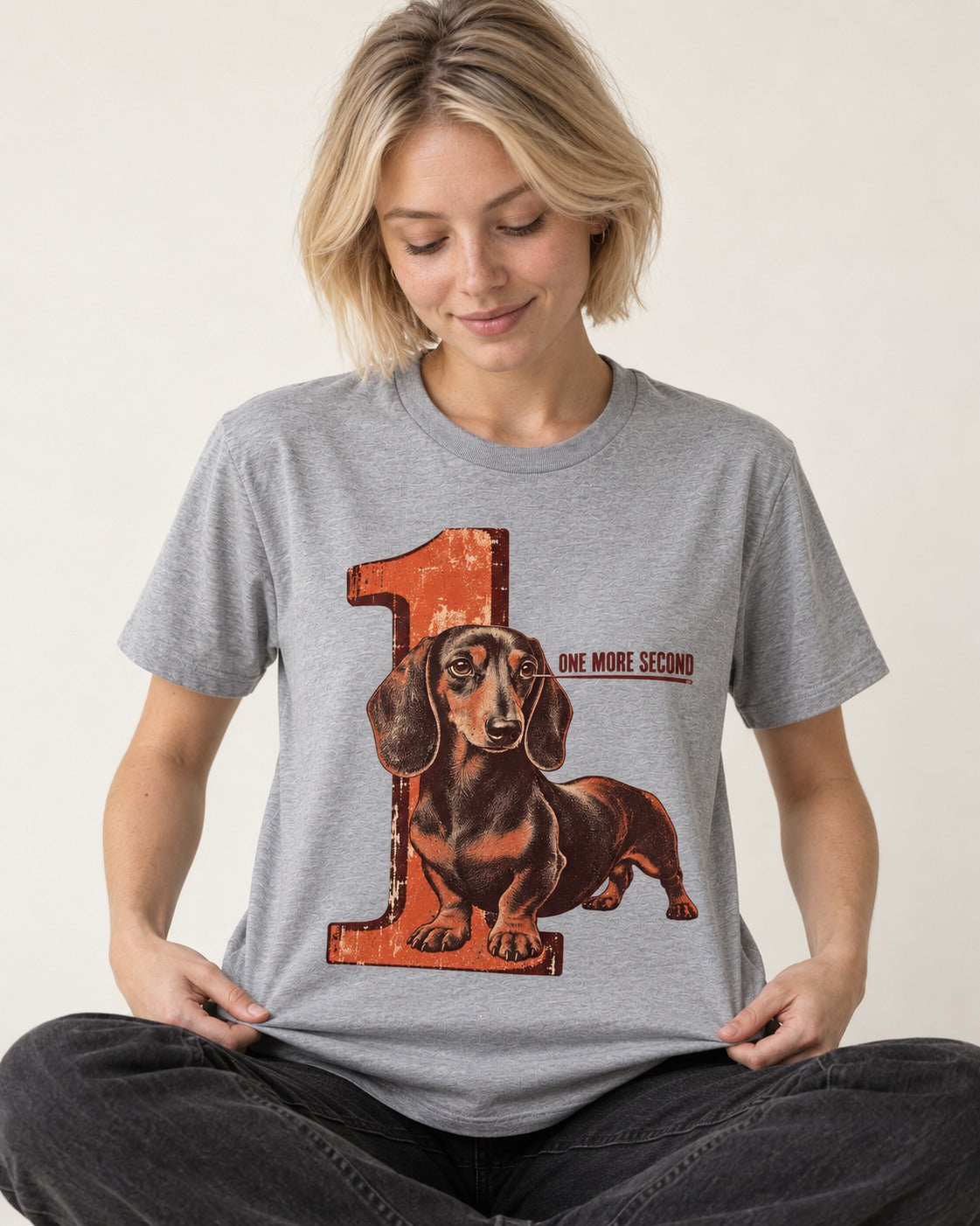 One More Second Dachshund T-Shirt in Sport Grey, worn by a seated model