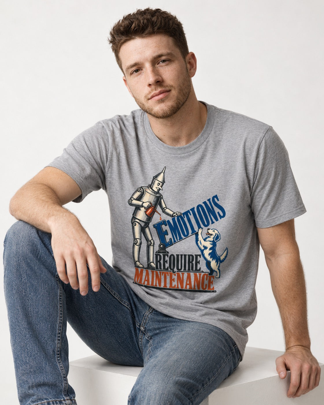 Golden Retriever Emotions Require Maintenance T-Shirt in Sport Grey, worn by a seated model