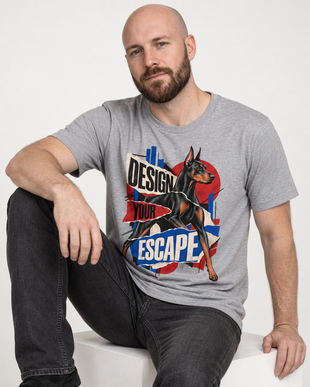 Doberman Escape T-Shirt in Sport Grey, worn by a seated model