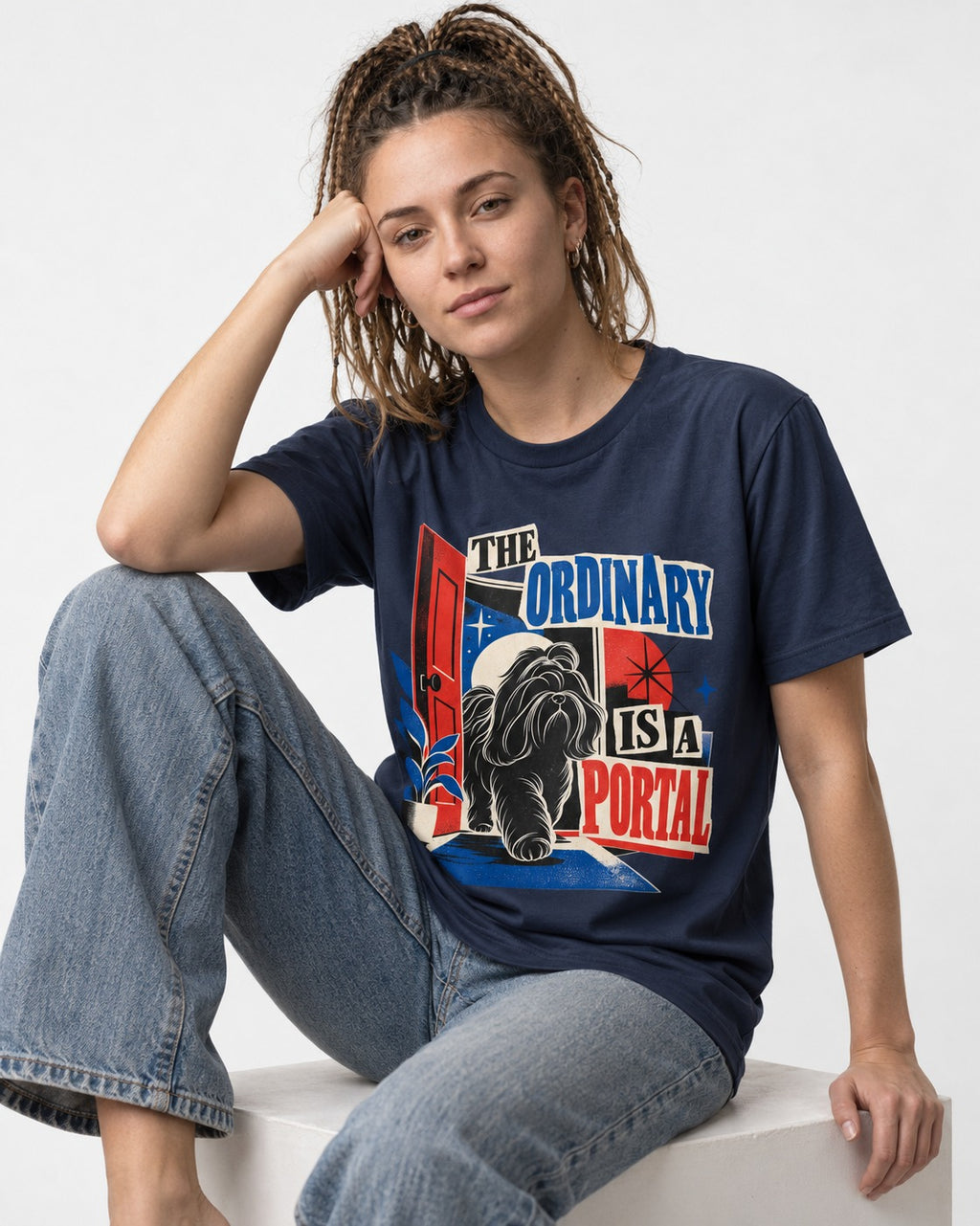 Shih Tzu The Ordinary Is a Portal Door Graphic T-Shirt in Navy, worn by a seated model