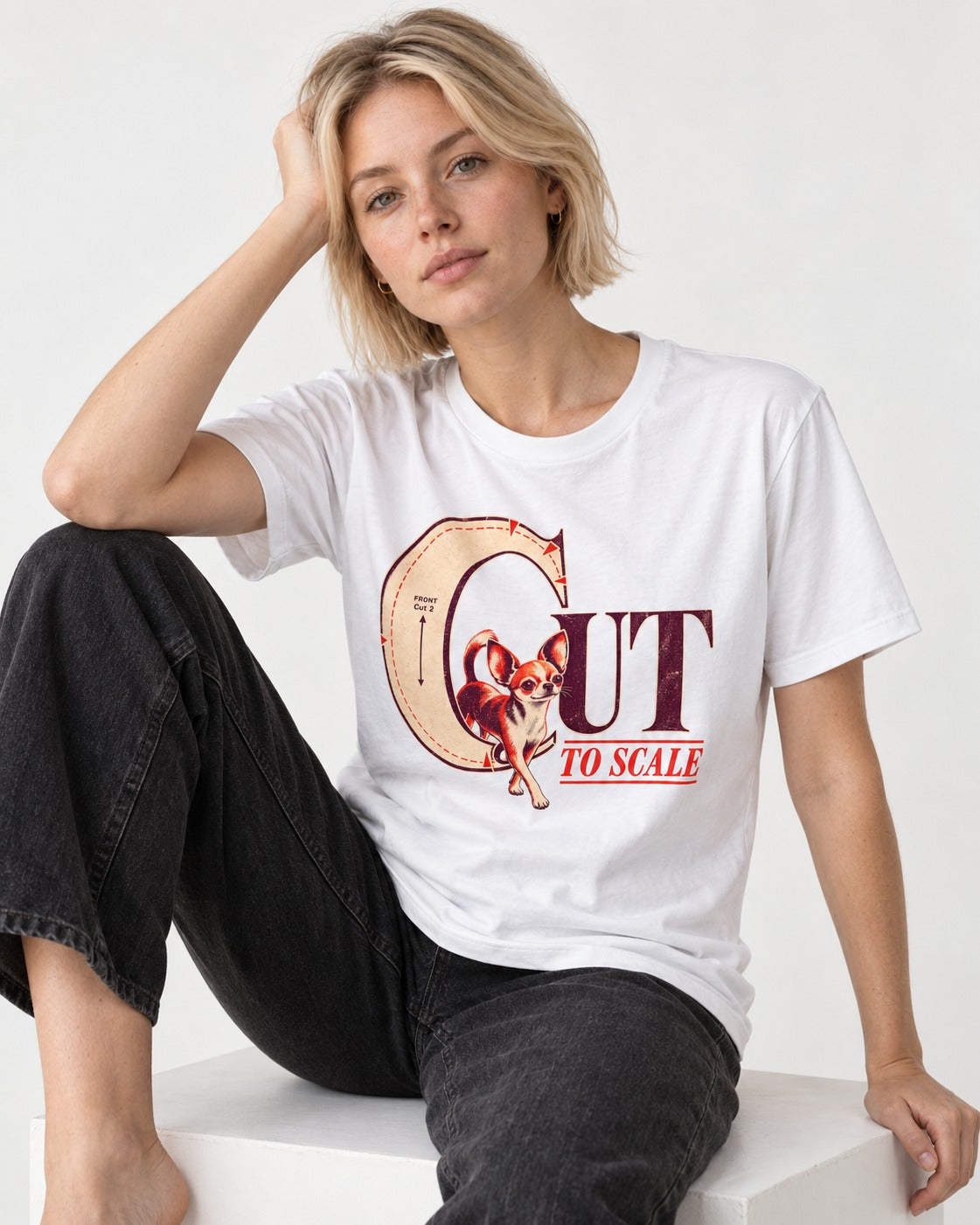 Chihuahua Cut to Scale Sewing Pattern Graphic T-Shirt in White, worn by a seated model