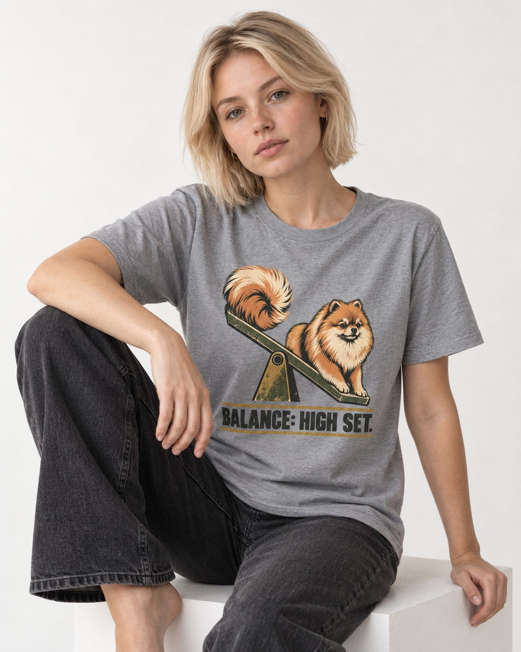 Pomeranian Balance High Set T-Shirt in Sport Grey, worn by a seated model