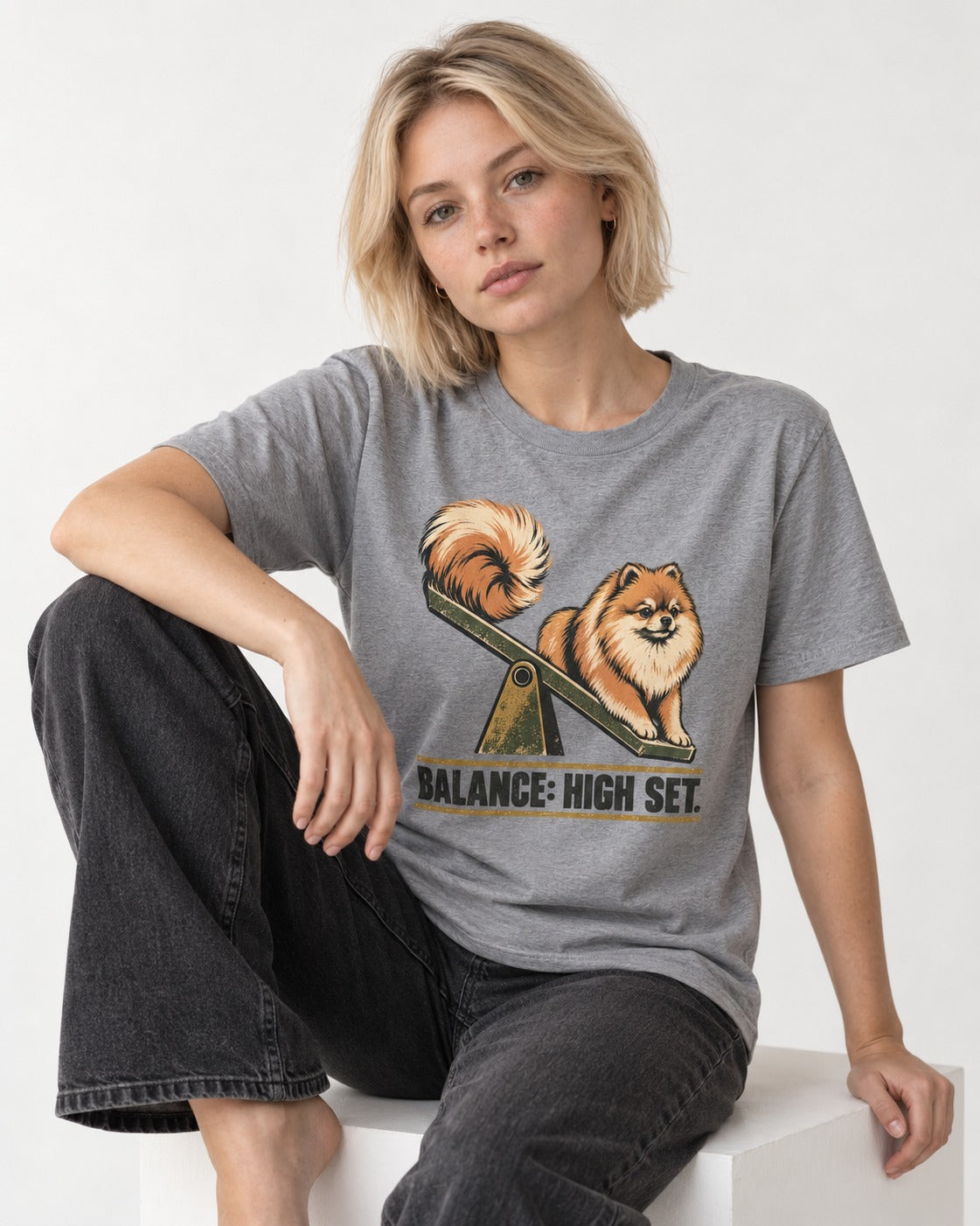 Pomeranian Balance High Set T-Shirt in Sport Grey, worn by a seated model