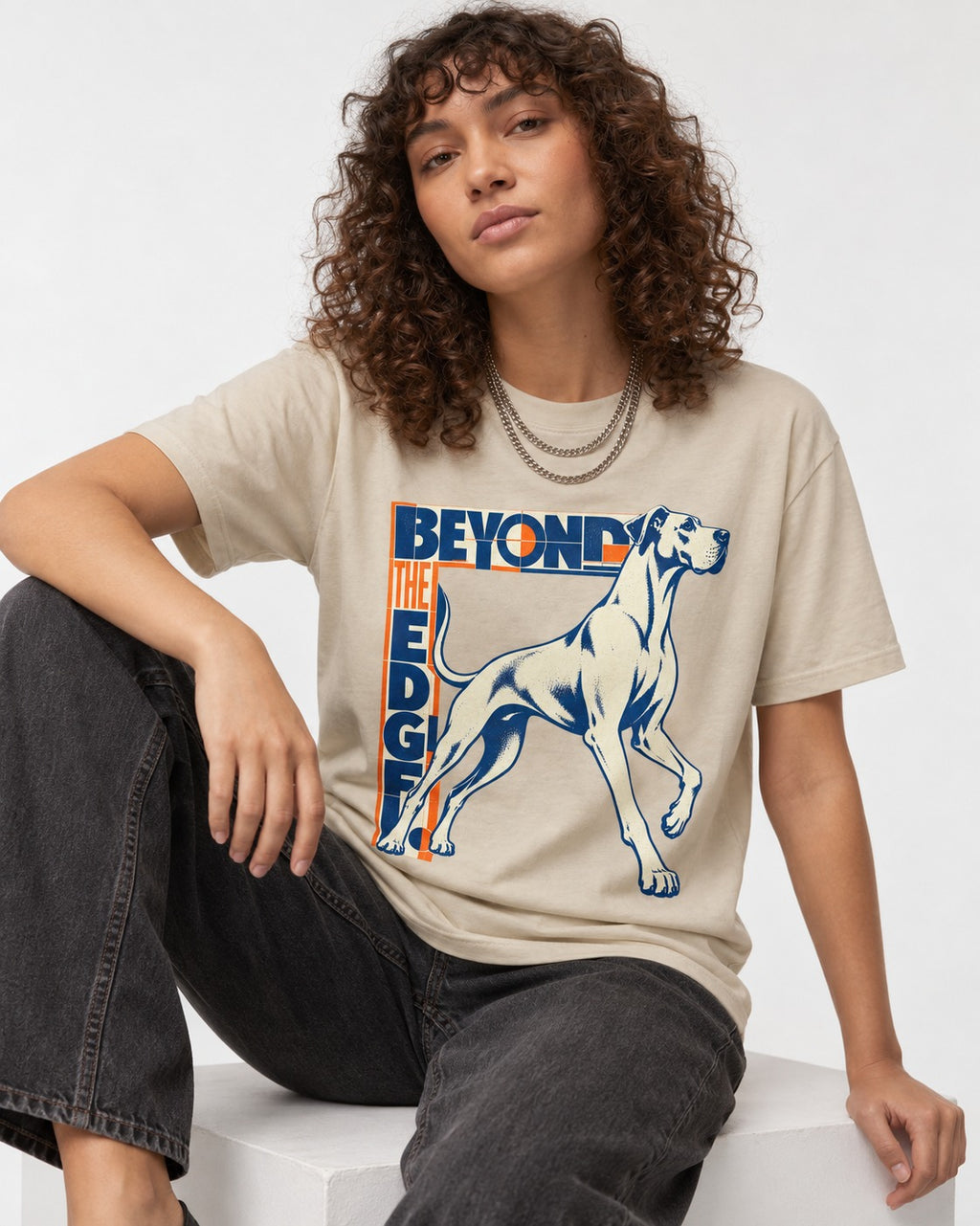 Great Dane Beyond the Edge T-Shirt in Sand, worn by a seated model