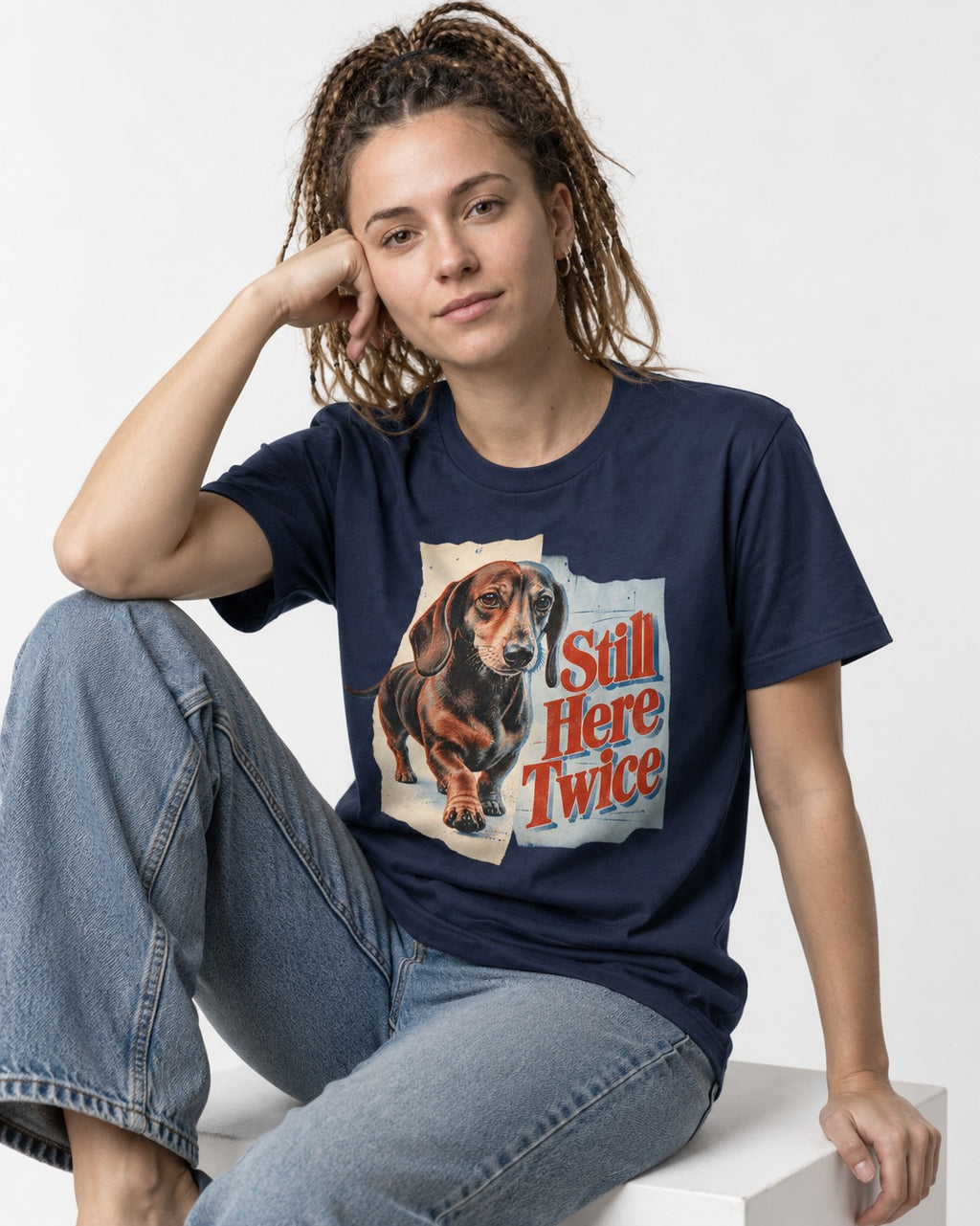 Dachshund Still Here Twice Torn Paper Graphic T-Shirt in Navy, worn by a seated model