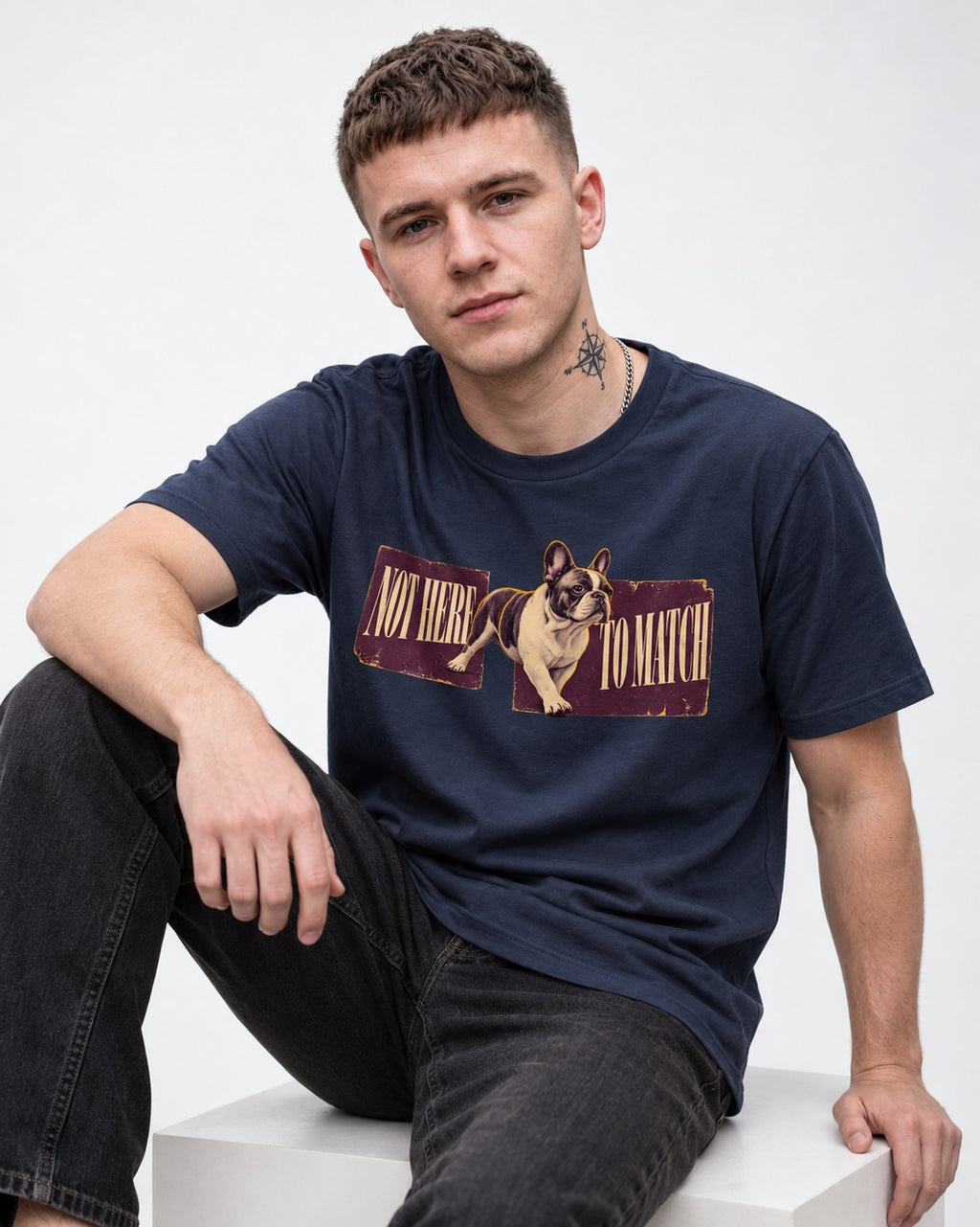 Frenchie Not Here to Watch Panels Graphic T-Shirt in Navy, worn by a seated model