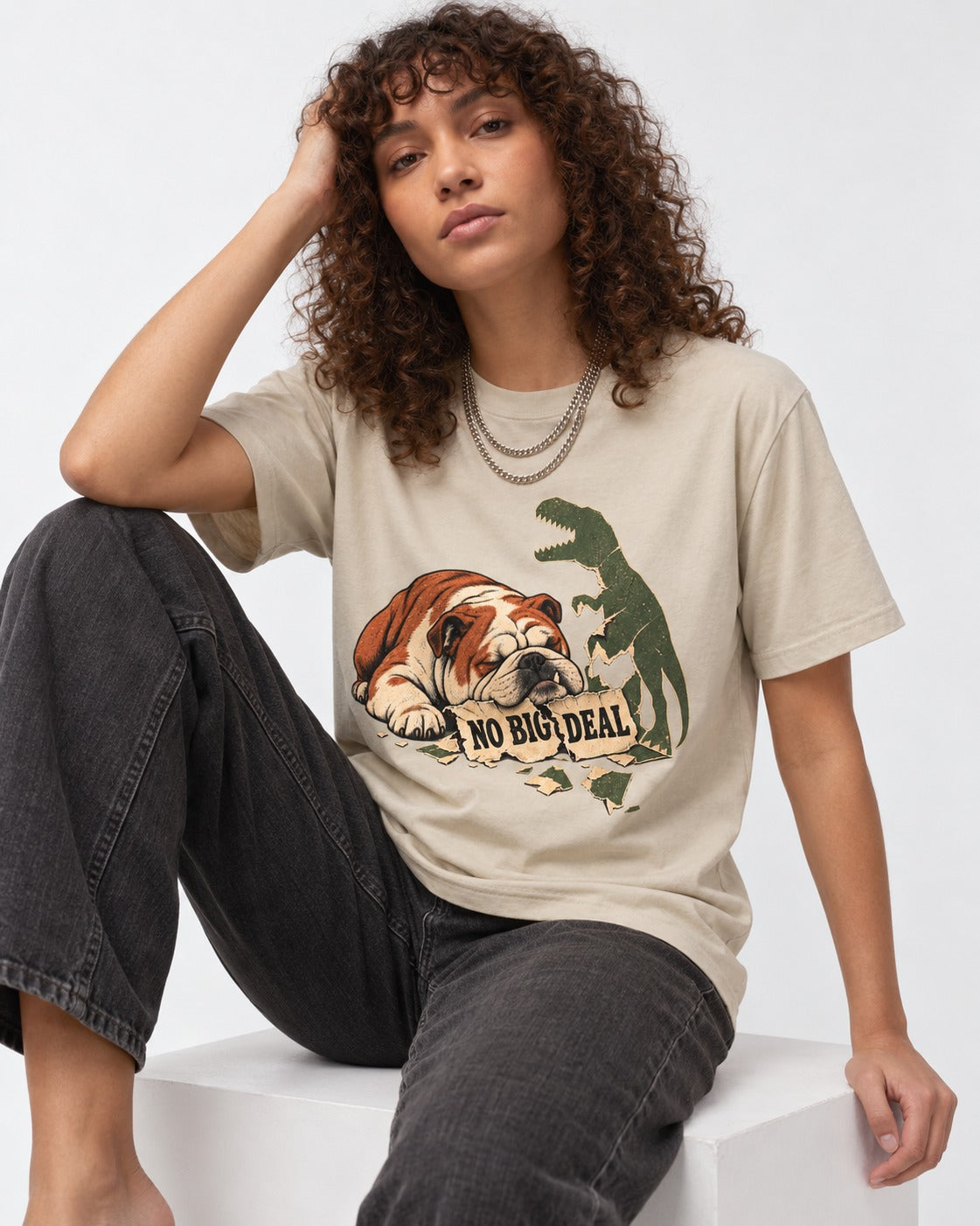 English Bulldog No Big Deal T-Shirt in Sand, worn by a seated model