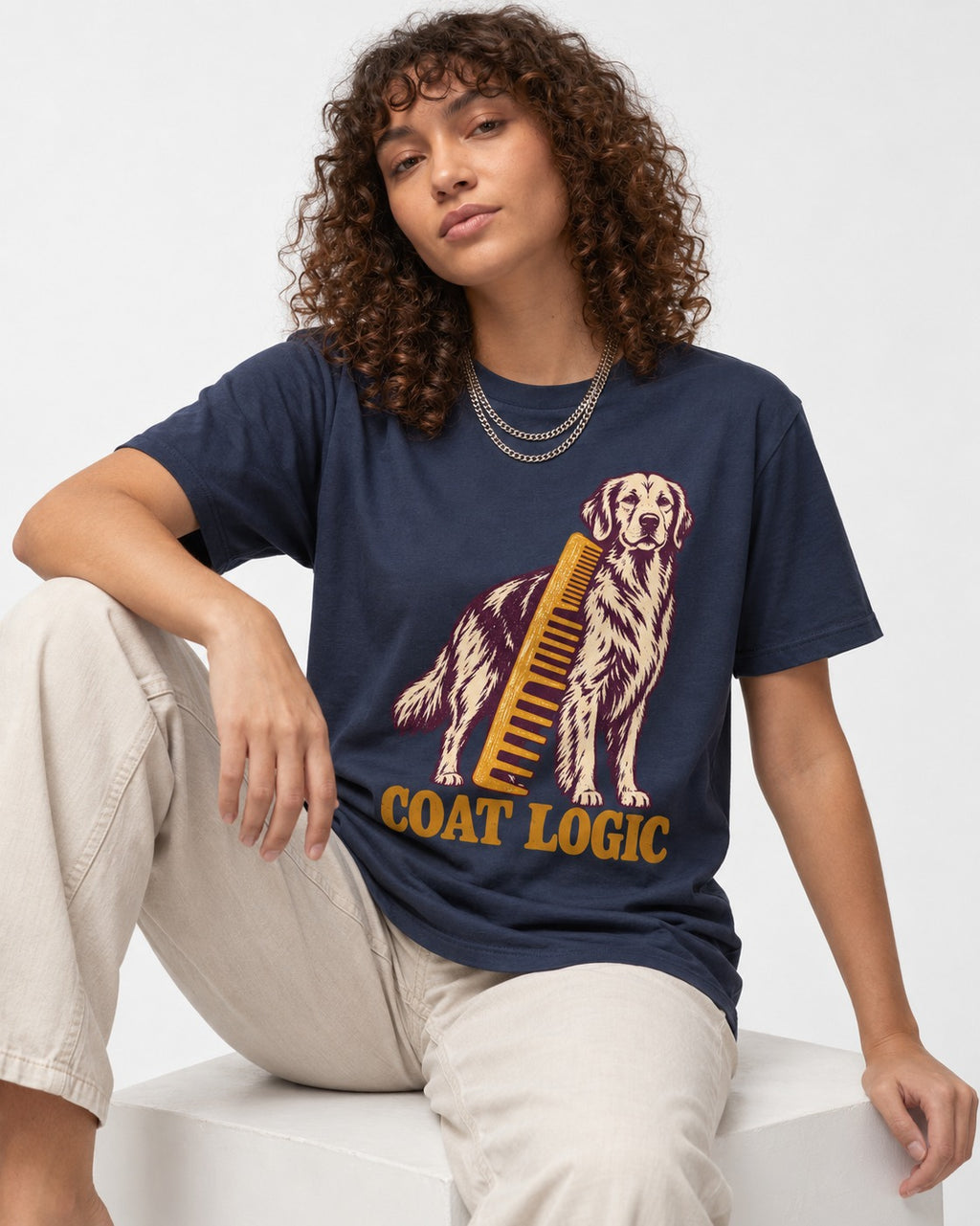 Golden Retriever Coat Logic Grooming Gauge Graphic T-Shirt in Navy, worn by a seated model