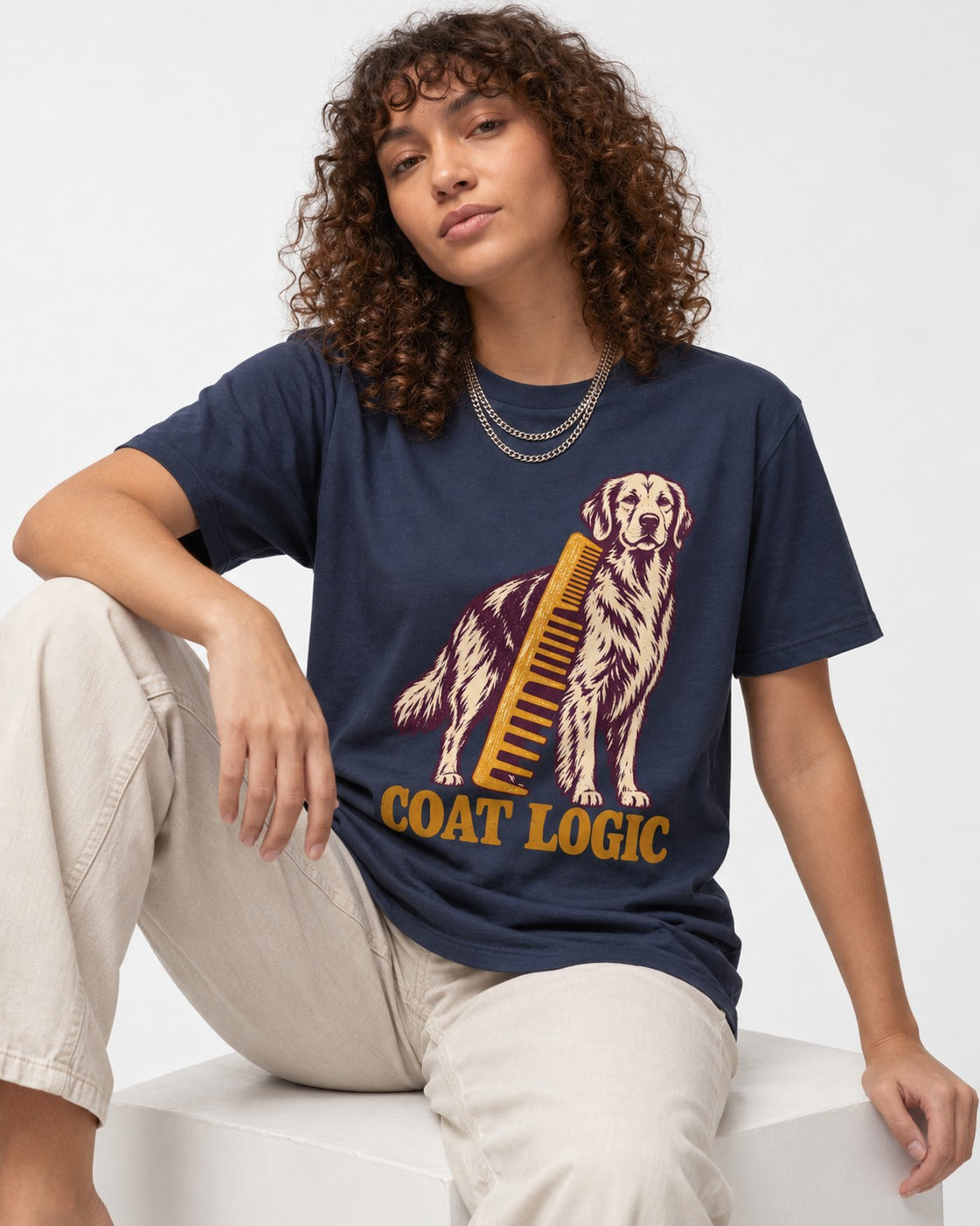Golden Retriever Coat Logic Grooming Gauge Graphic T-Shirt in Navy, worn by a seated model
