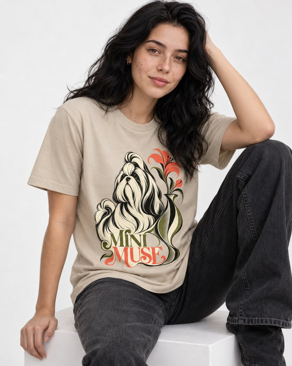 Shih Tzu Mini Muse T-Shirt in Sand, worn by a seated model