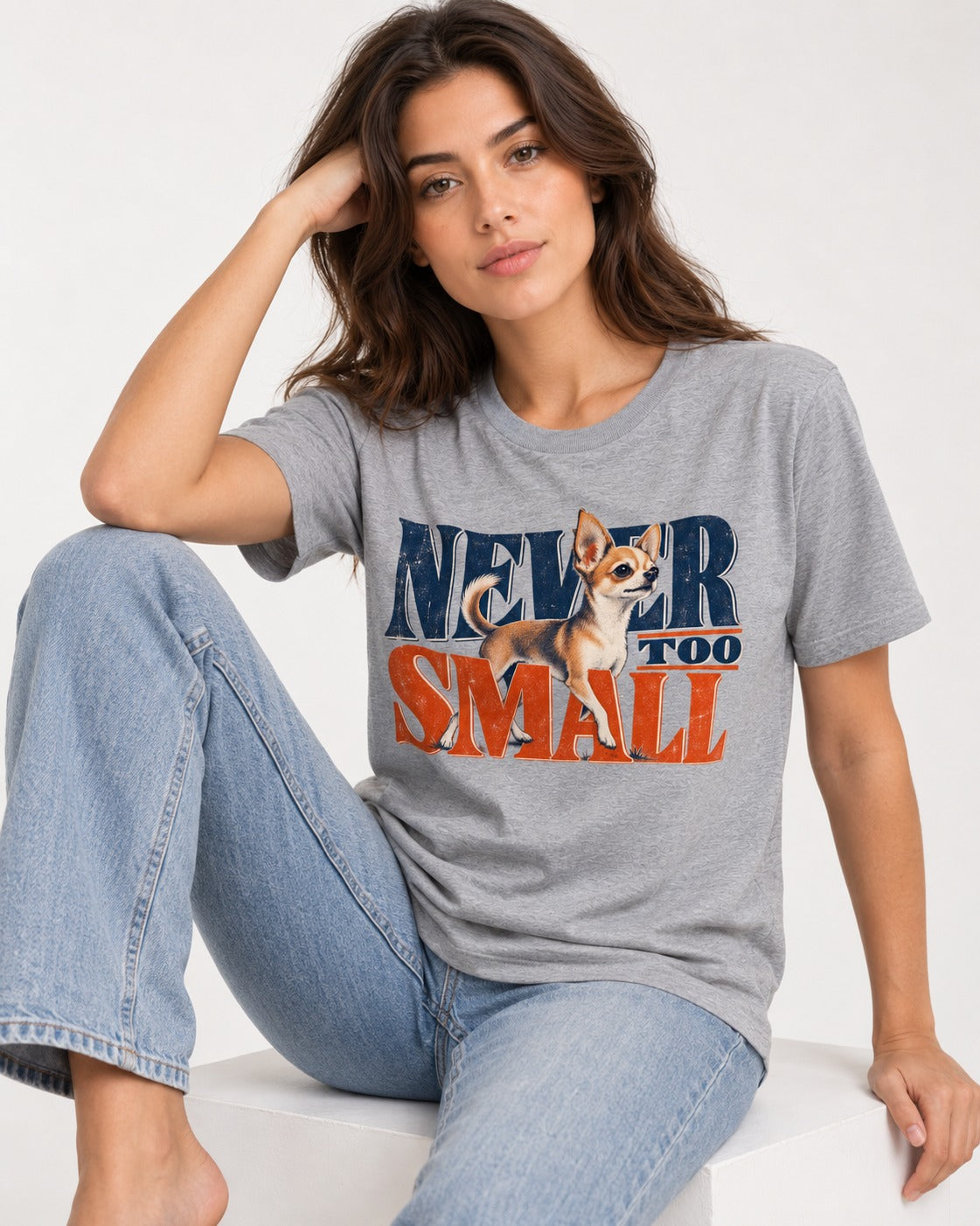 Chihuahua Never Too Small T-Shirt in Sport Grey, worn by a seated model