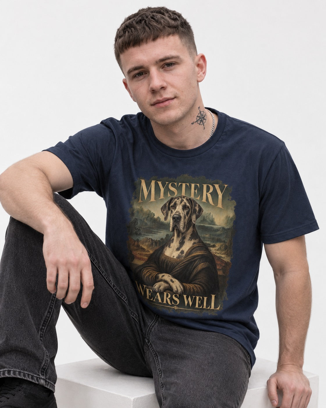 Great Dane Mystery Wears Well Renaissance Portrait Graphic T-Shirt in Navy, worn by a seated model