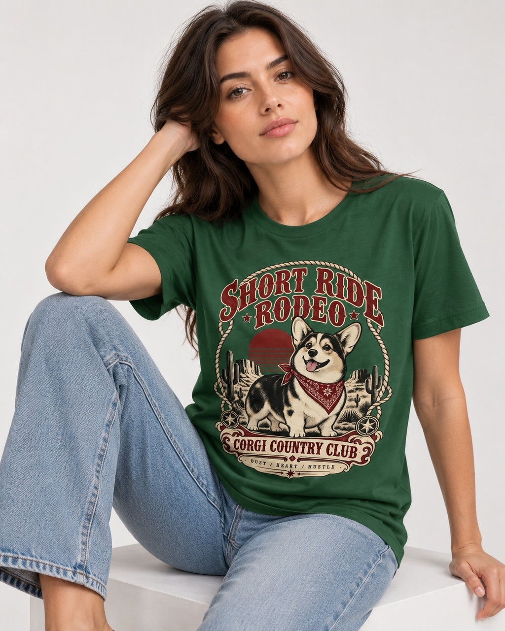 Corgi Short Ride Rodeo Country Club Badge T-Shirt in Forest Green, worn by a seated model
