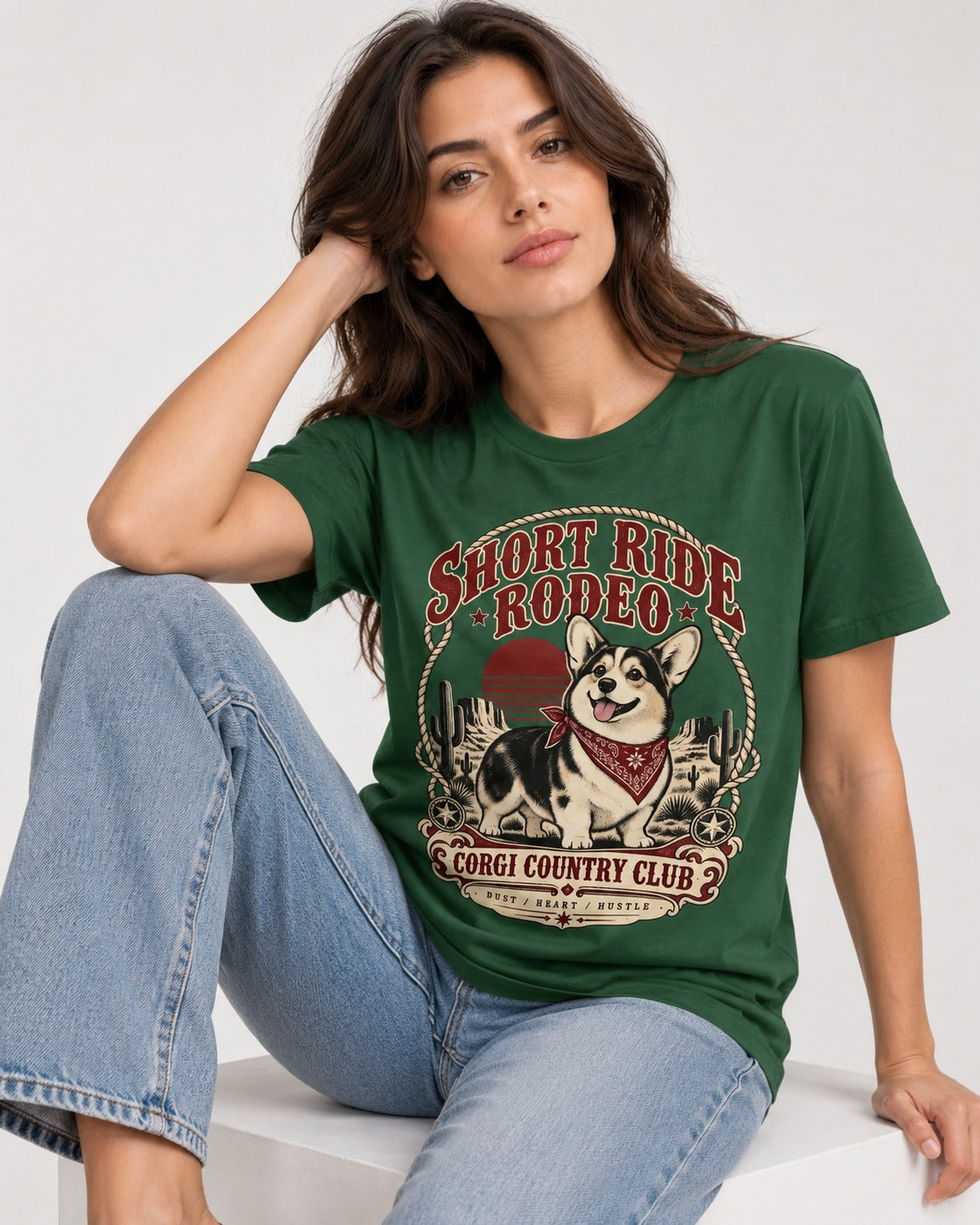 Corgi Short Ride Rodeo Country Club Badge T-Shirt in Forest Green, worn by a seated model