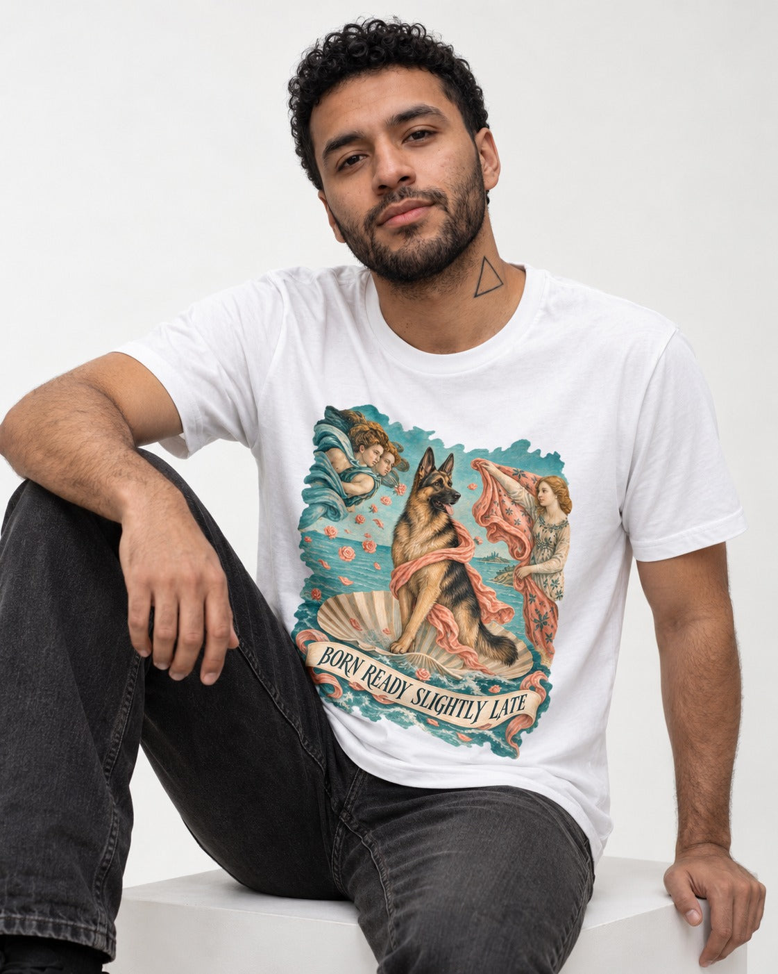 German Shepherd Dog Born Ready Slightly Late Venus Graphic T-Shirt in White, worn by a seated model