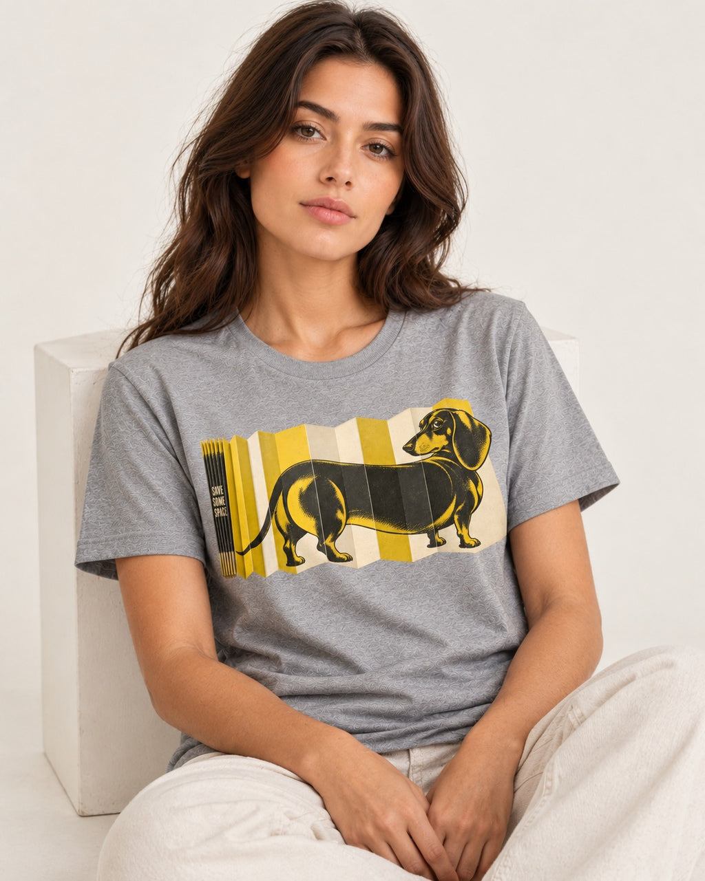 Dachshund Save Some Space Accordion Screen Graphic T-Shirt in Sport Grey, worn by a seated model