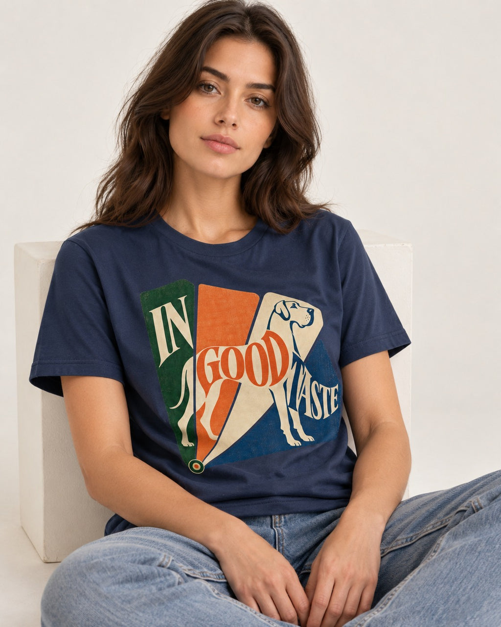 Great Dane In Good Taste Color Fan Graphic T-Shirt in Navy, worn by a seated model