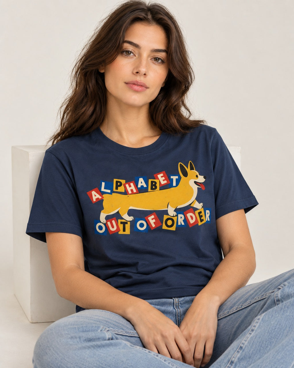 Corgi Alphabet Out of Order Graphic T-Shirt in Navy, worn by a seated model