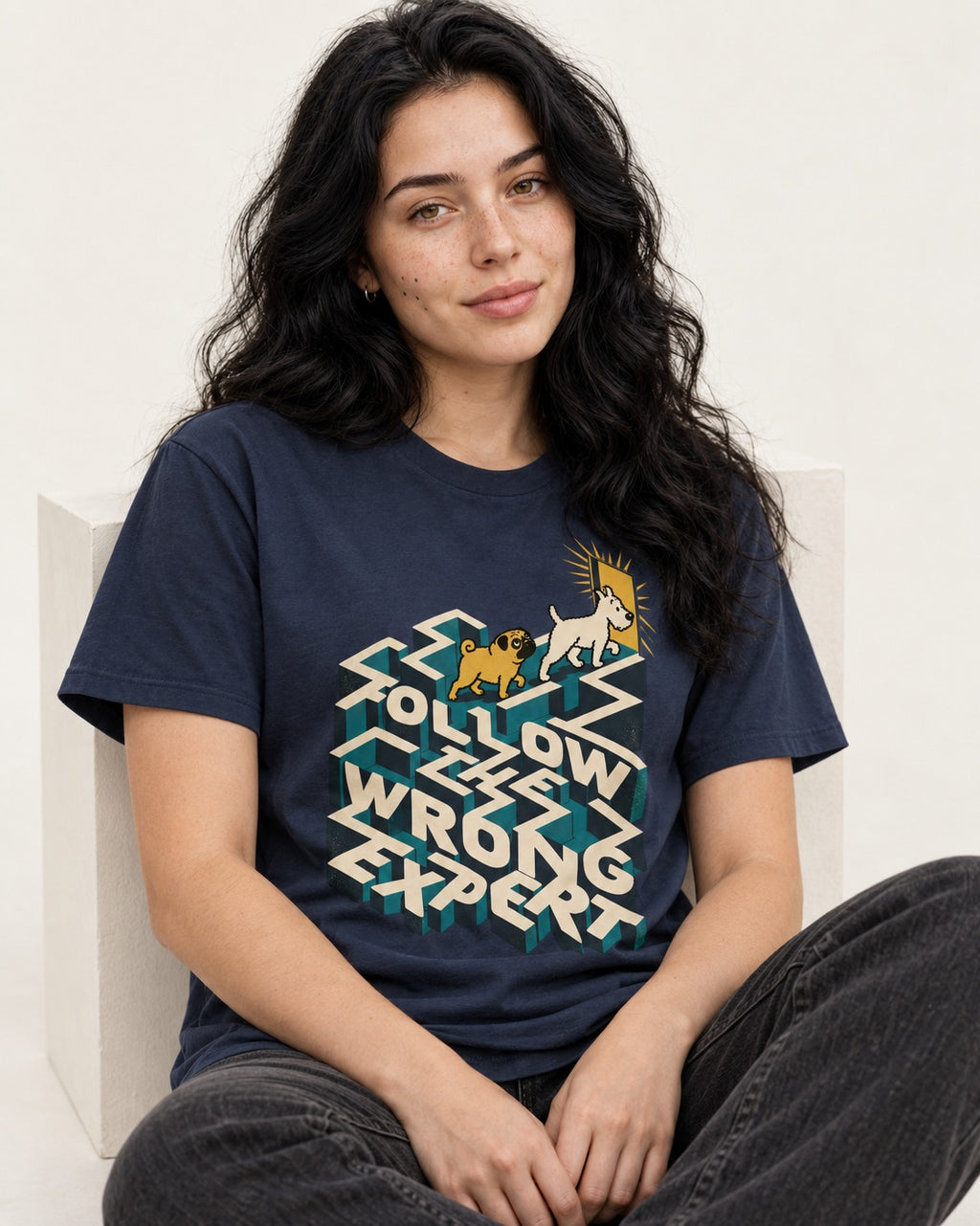 Pug Follow the Wrong Expert Isometric Maze Graphic T-Shirt in Navy, worn by a seated model