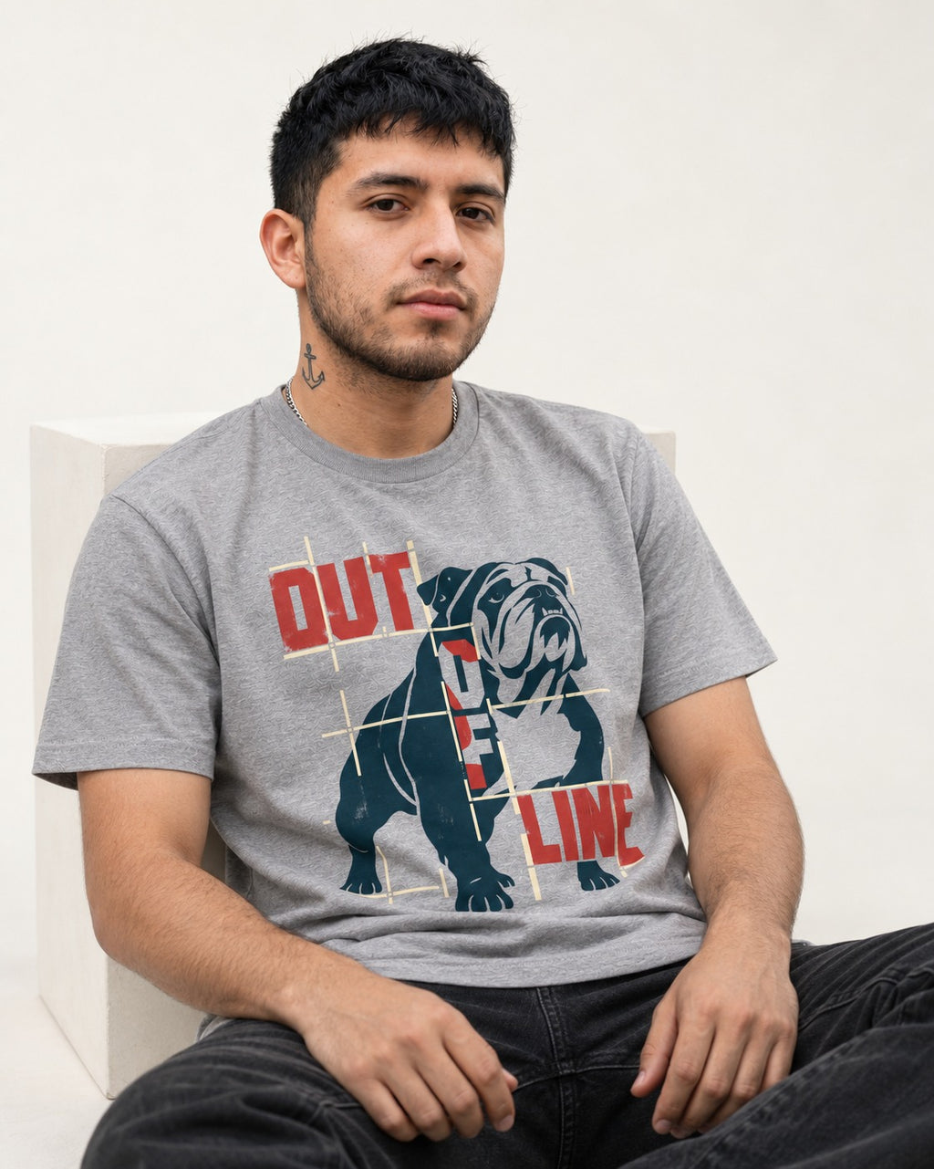 English Bulldog Out of Line T-Shirt in Sport Grey, worn by a seated model