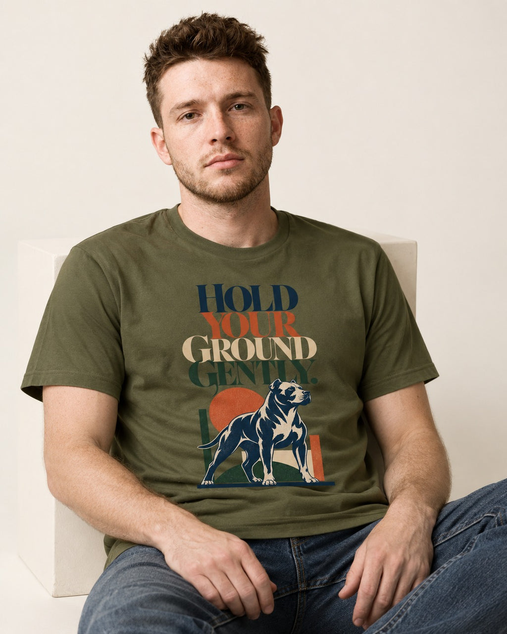 Pitbull Hold Your Ground Gently Standing Dog Graphic T-Shirt in Heather Military Green, worn by a seated model