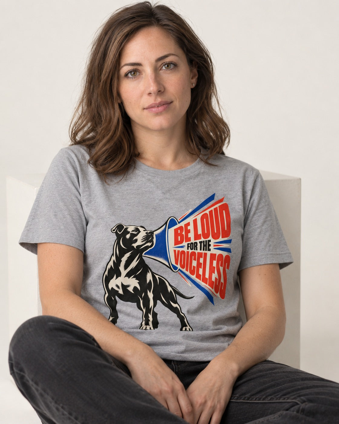 Pitbull For the Voiceless T-Shirt in Sport Grey, worn by a seated model