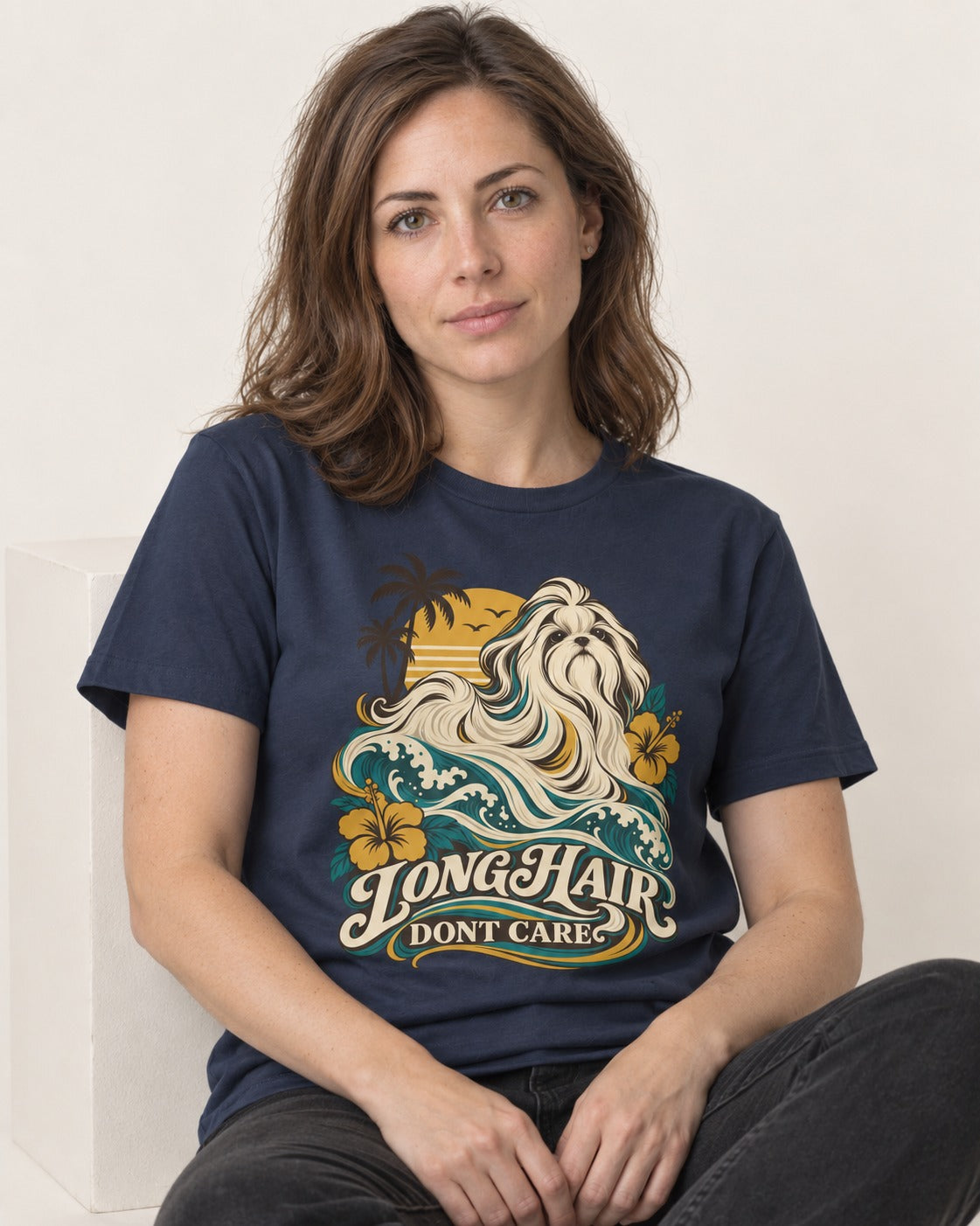 Shih Tzu Long Hair Don't Care Tropical Wave Graphic T-Shirt in Navy, worn by a seated model