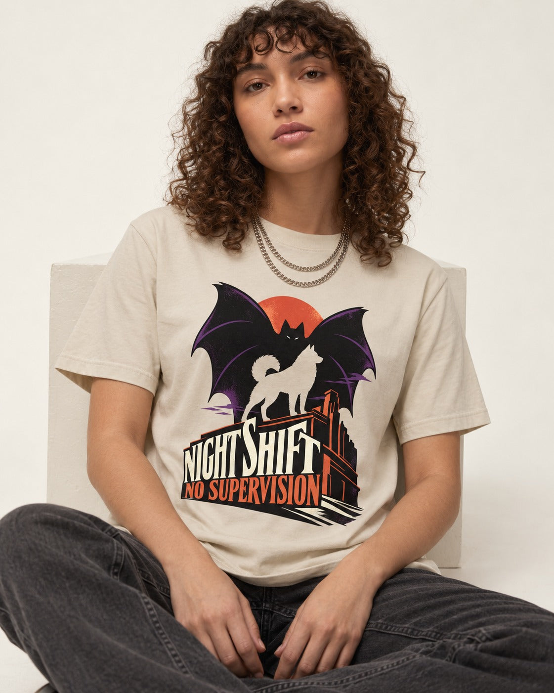 Husky Night Shift No Supervision T-Shirt in Sand, worn by a seated model
