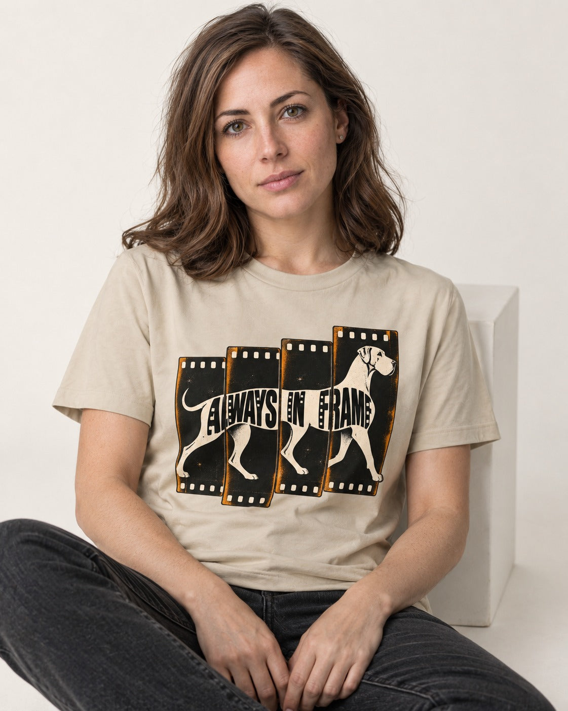 Great Dane Always in Frame T-Shirt in Sand, worn by a seated model