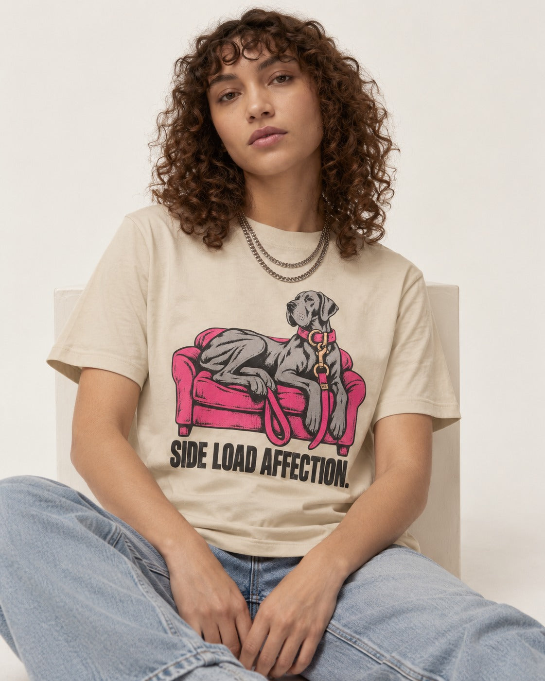 Great Dane Side Load Affection T-Shirt in Sand, worn by a seated model