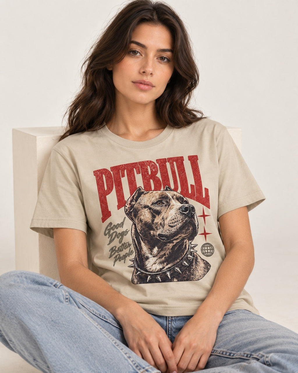 Pitbull Makes Better People T-Shirt in Sand, worn by a seated model