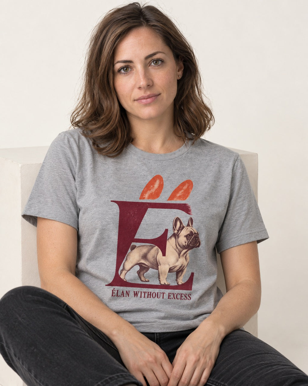 Frenchie Without Excess T-Shirt in Sport Grey, worn by a seated model