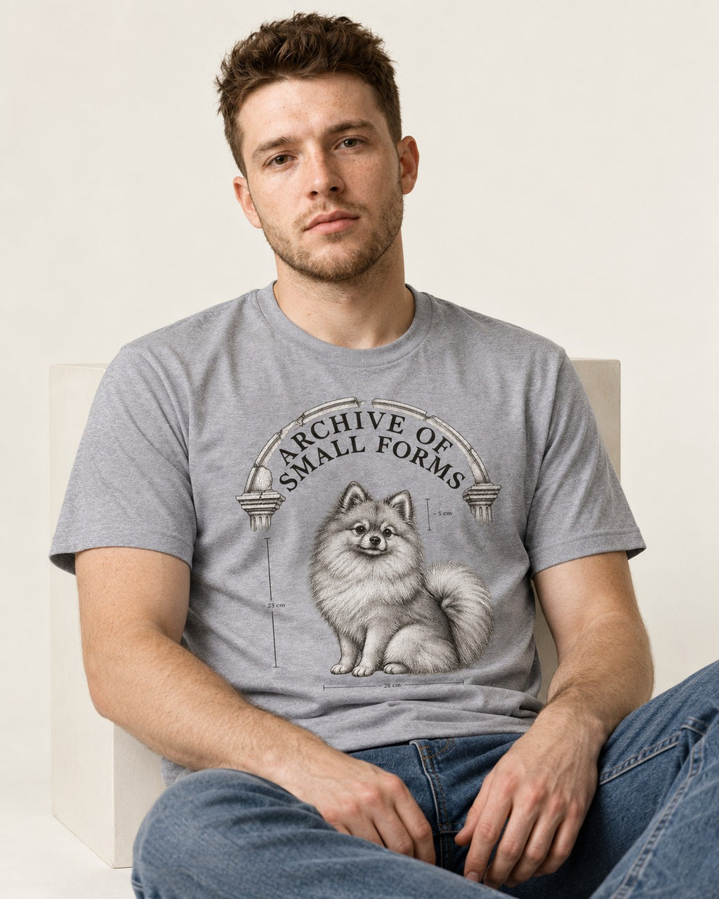 Pomeranian Archive of Small Forms T-Shirt in Sport Grey, worn by a seated model