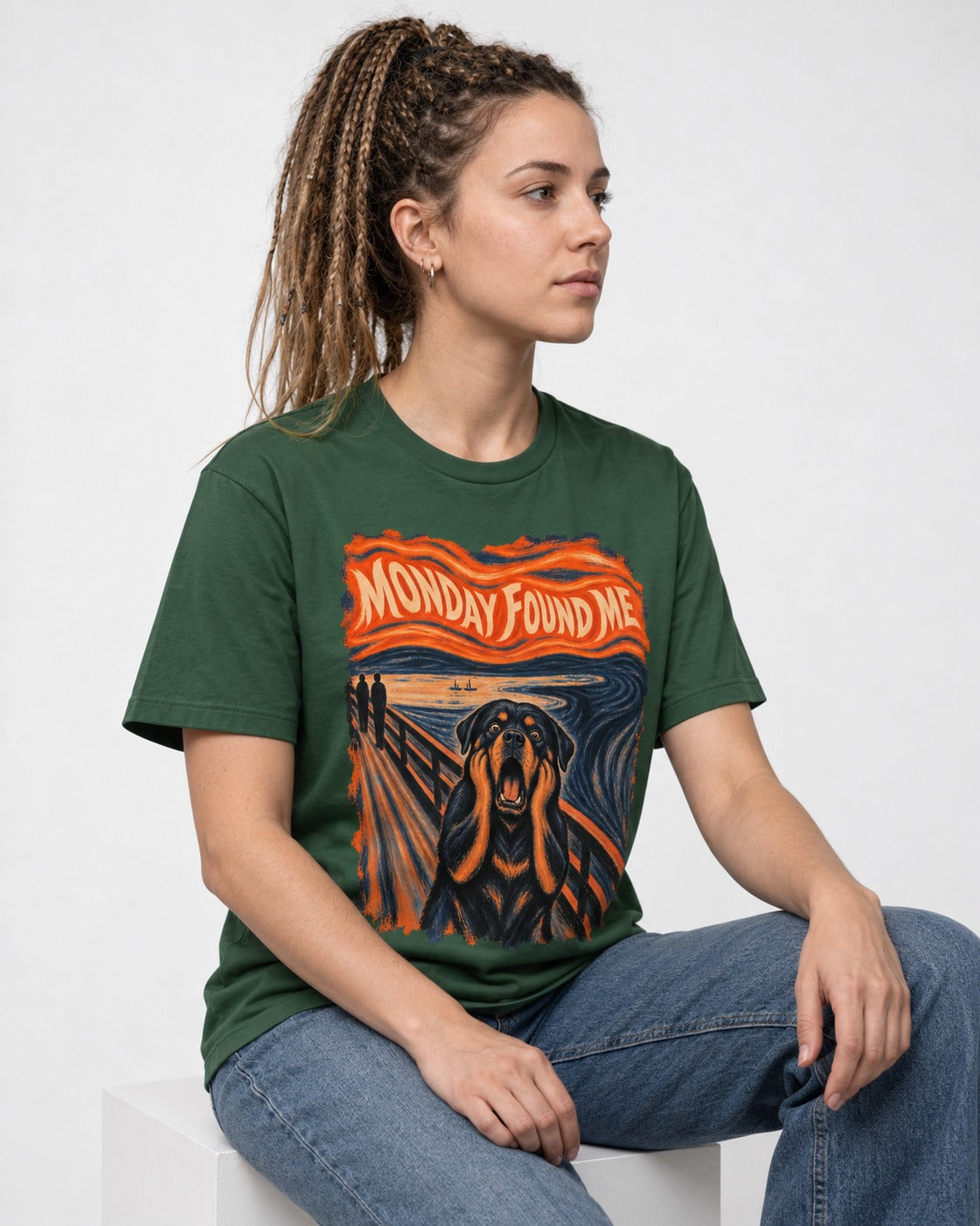 Rottweiler Monday Found Me Scream Parody Graphic T-Shirt in Forest Green, worn by a seated model