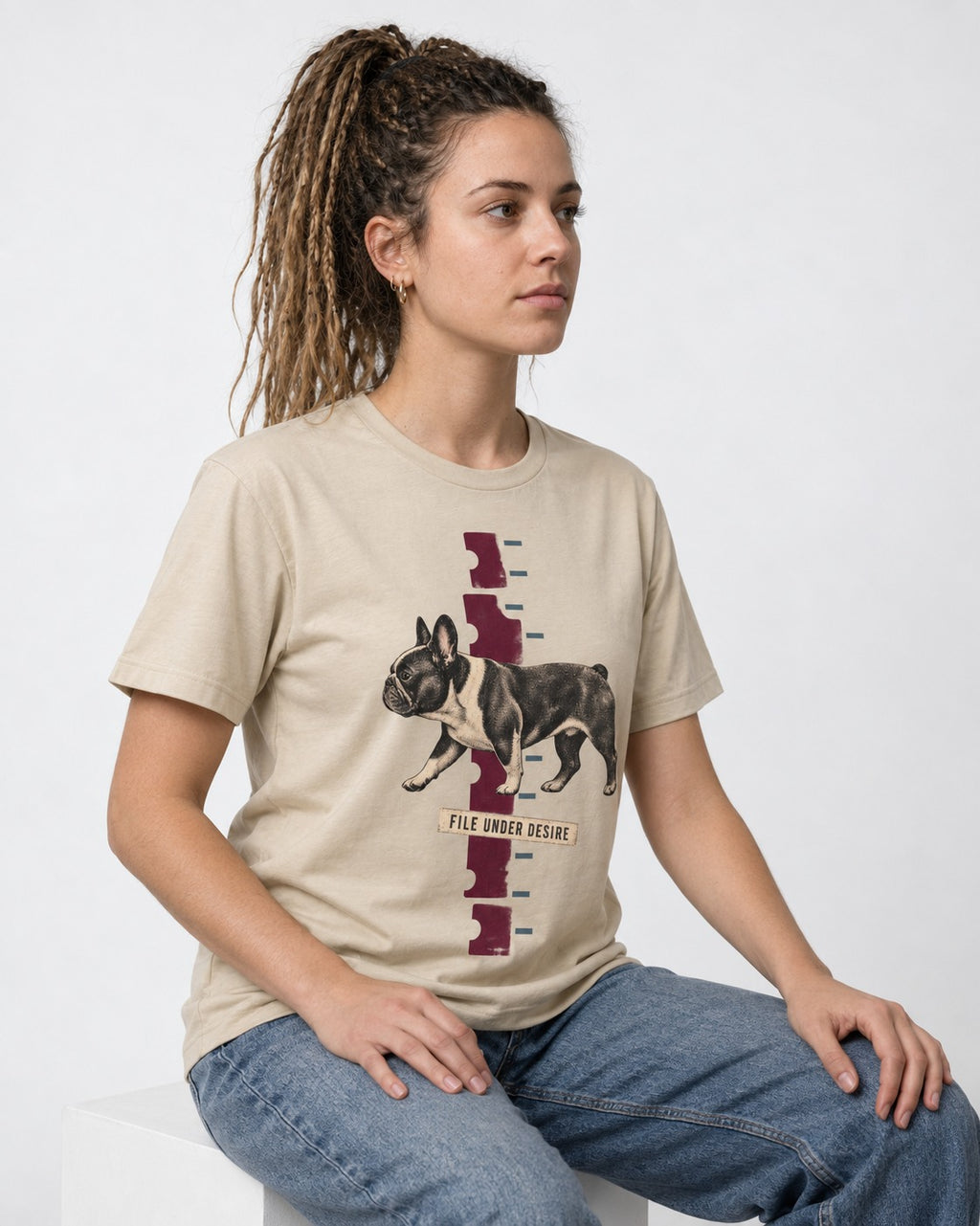 File Under Frenchie Desire T-Shirt in Sand, worn by a seated model
