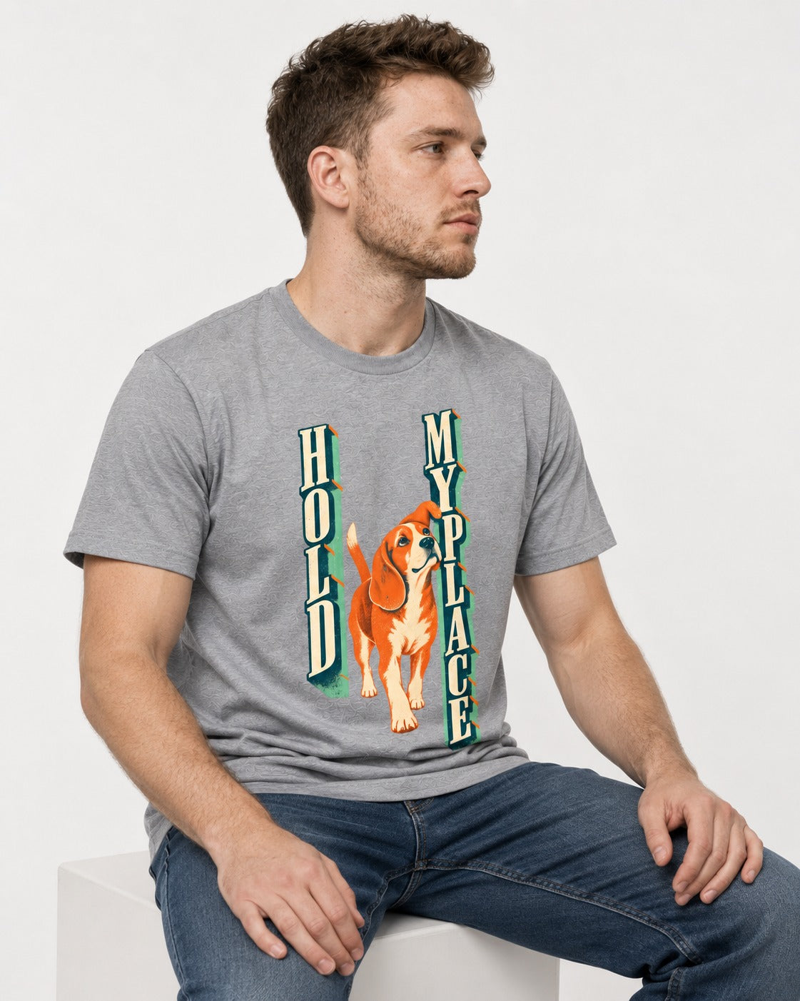 Vintage Beagle Hold My Place T-Shirt in Sport Grey, worn by a seated model