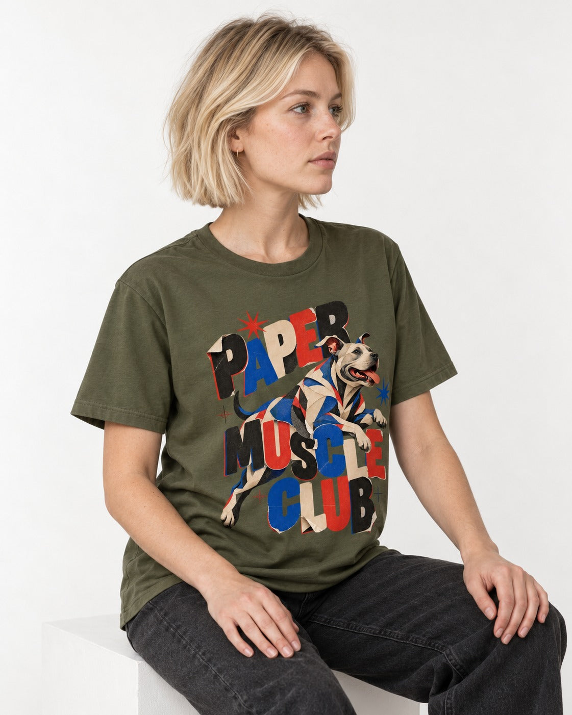 Pitbull Paper Muscle Club Collage Graphic T-Shirt in Heather Military Green, worn by a seated model
