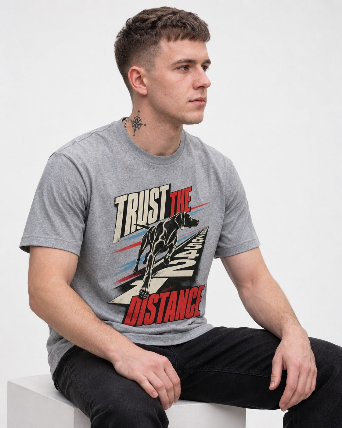 Trust the Distance German Shorthaired Pointer Graphic T-Shirt in Sport Grey, worn by a seated model