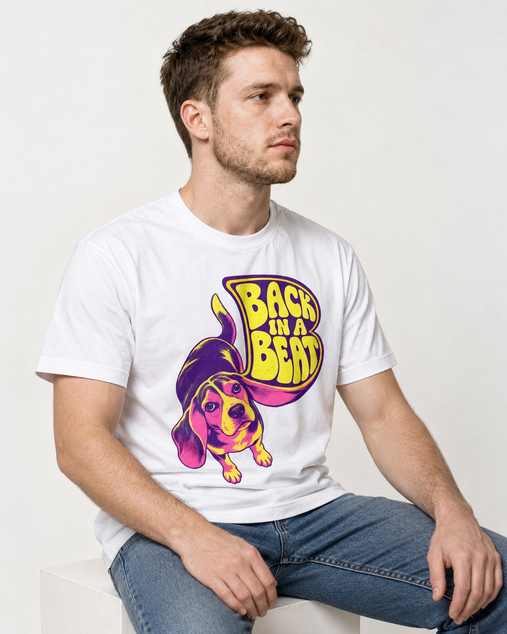 Groovy Beagle Back In A Beat T-Shirt in White, worn by a seated model