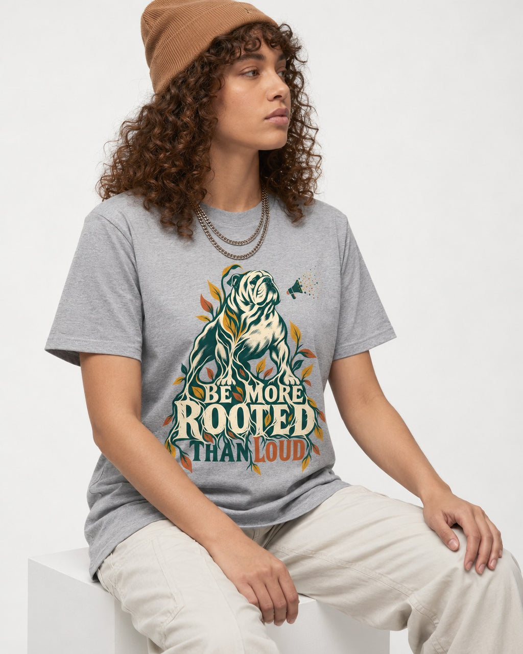 More Rooted Than Loud English Bulldog T-Shirt in Sport Grey, worn by a seated model