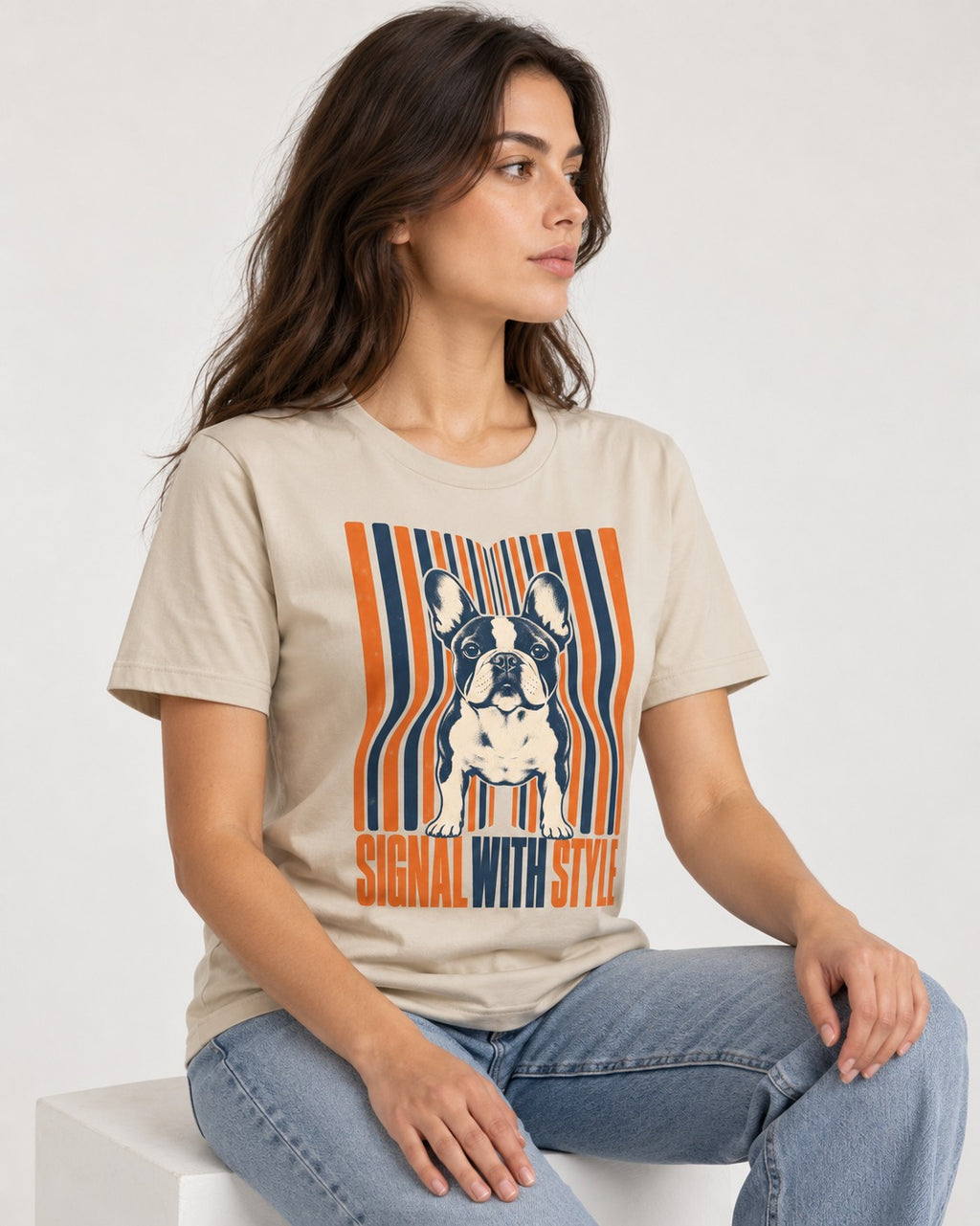 Frenchie Signal T-Shirt in Sand, worn by a seated model