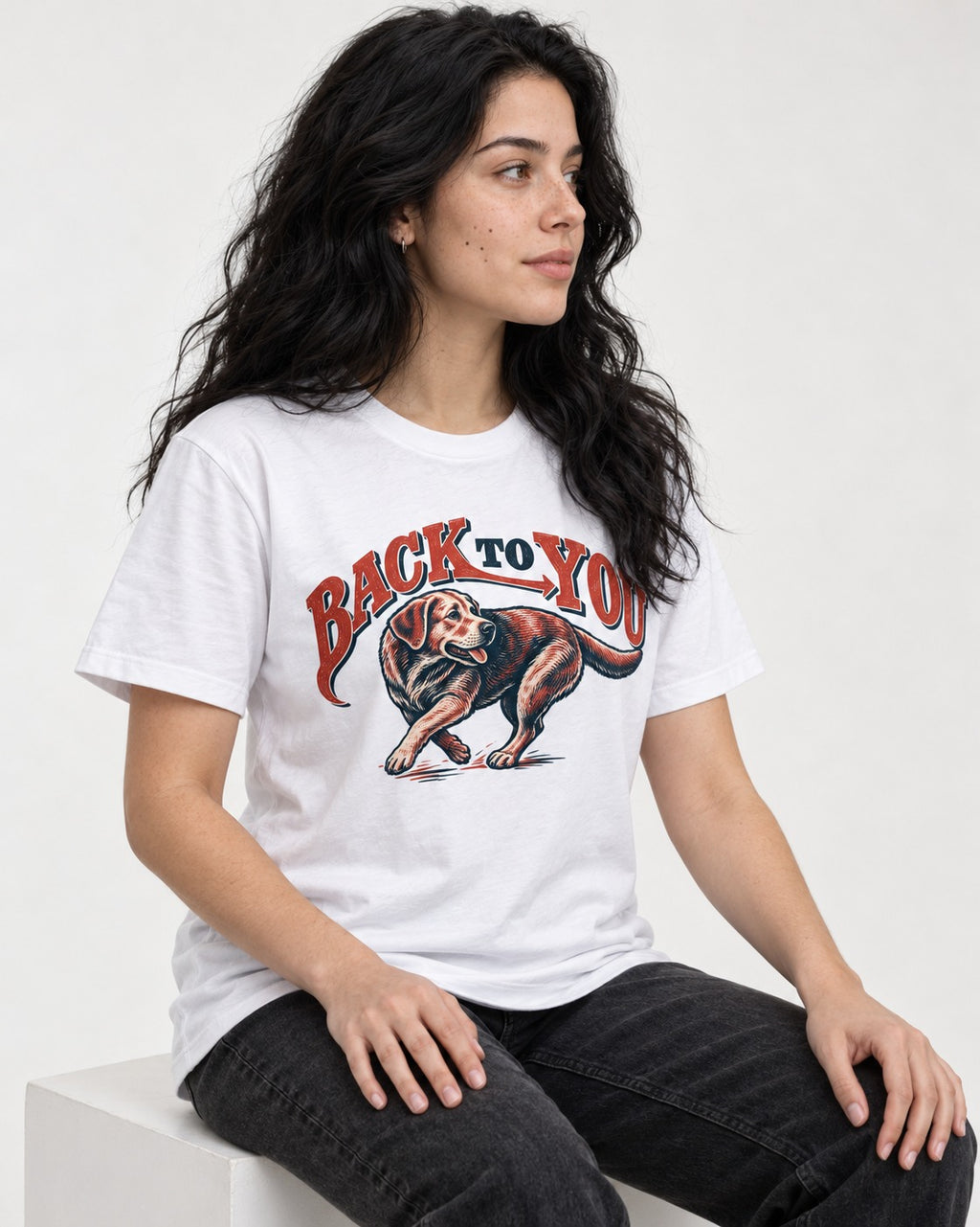 Labrador Retriever Back to You Turning Graphic T-Shirt in White, worn by a seated model