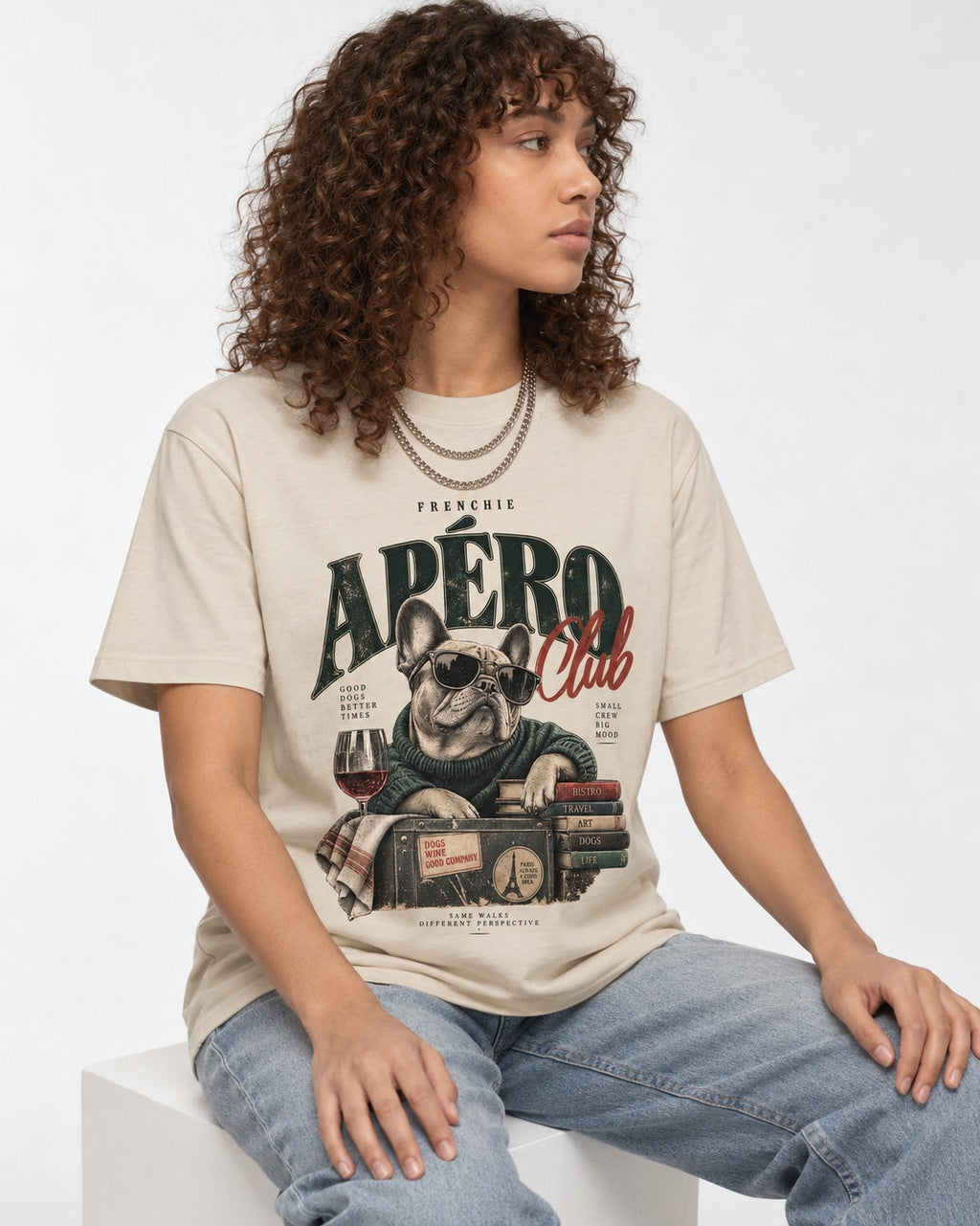 Frenchie Apero Club T-Shirt in Sand, worn by a seated model