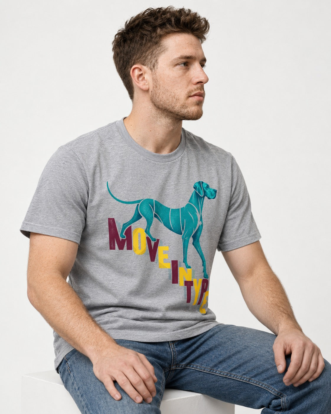 Great Dane Move in Type T-Shirt in Sport Grey, worn by a seated model