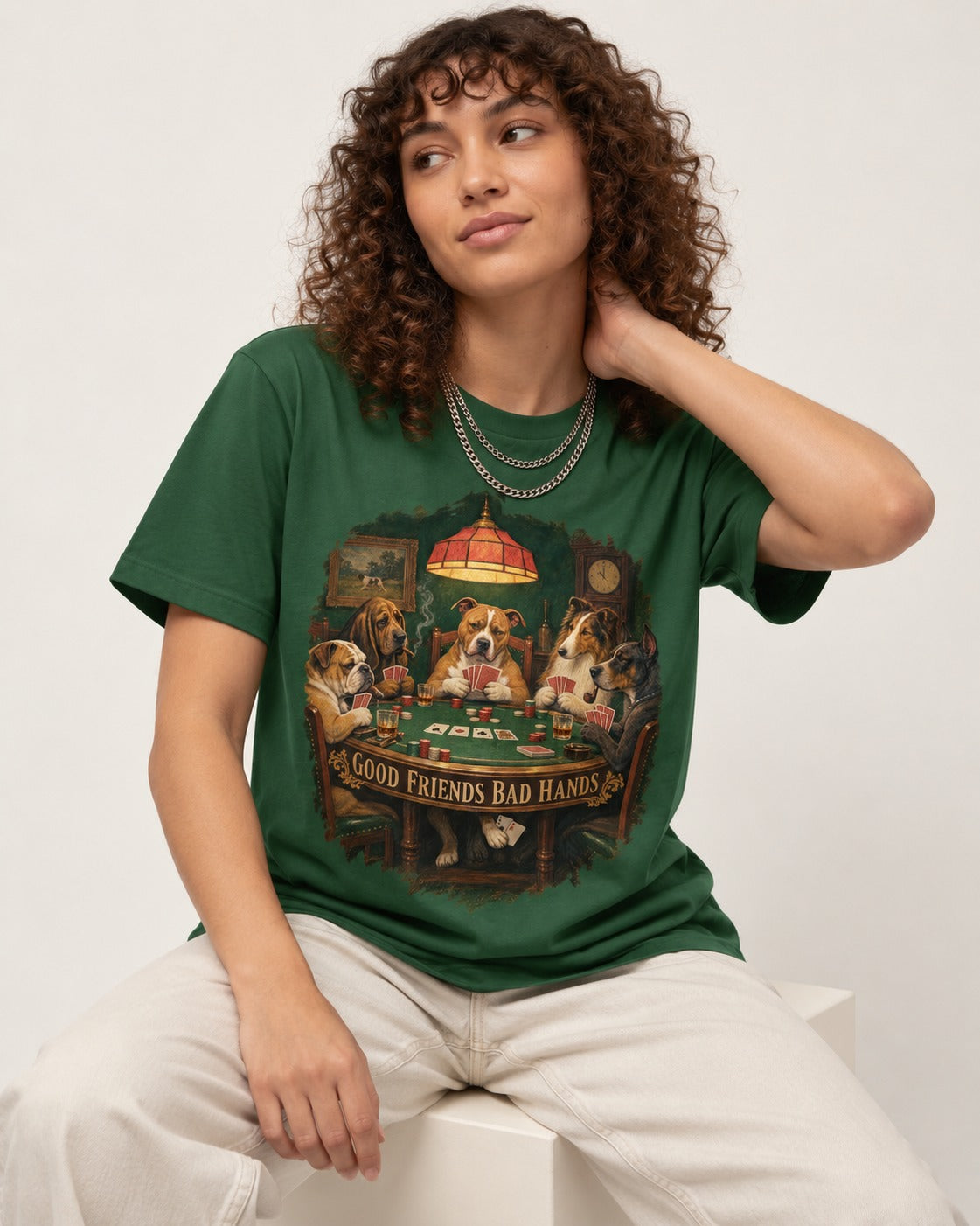 Pitbull Good Friends Bad Hands Poker Night Graphic T-Shirt in Forest Green, worn by a seated model