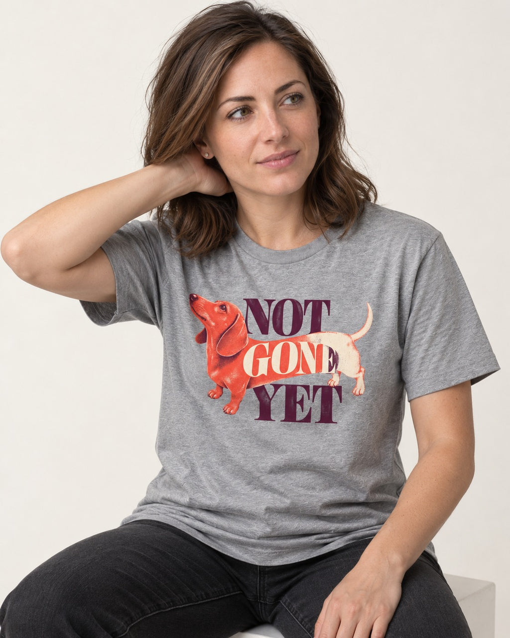 Dachshund Not Gone Yet T-Shirt in Sport Grey, worn by a seated model
