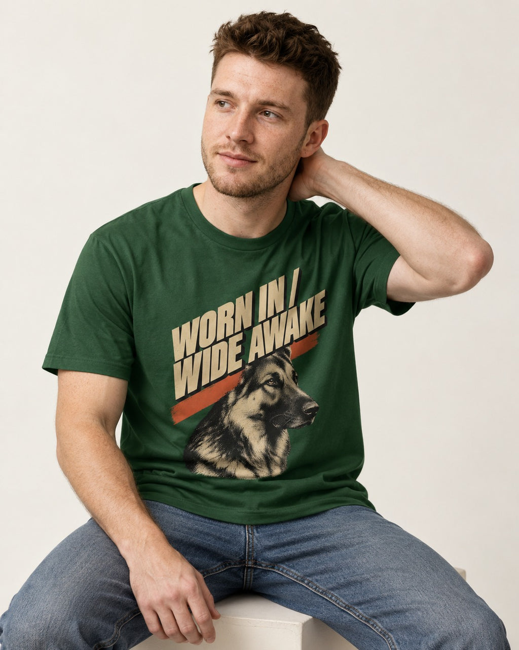 Worn In Wide Awake Portrait German Shepherd Dog Graphic T-Shirt in Forest Green, worn by a seated model