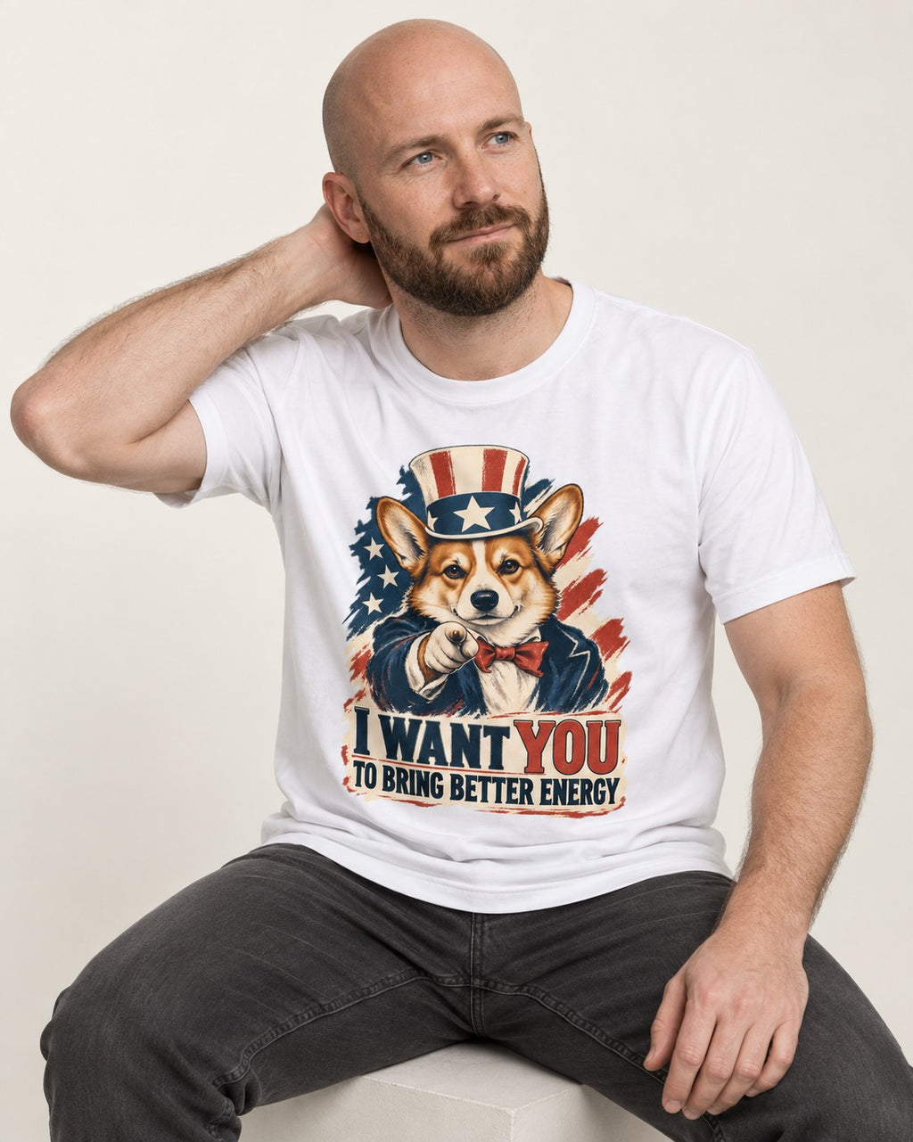 Corgi I Want You to Bring Better Energy Uncle Sam T-Shirt in White, worn by a seated model