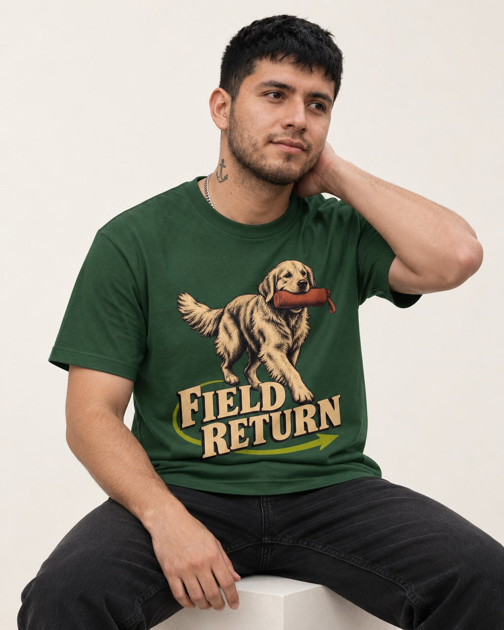 Golden Retriever Field Return Training Dummy Graphic T-Shirt in Forest Green, worn by a seated model
