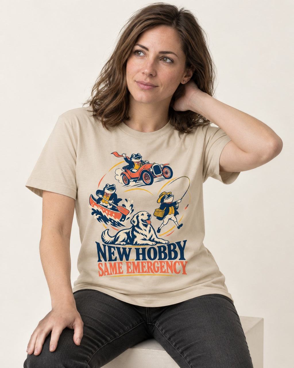 Golden Retriever New Hobby Same Emergency T-Shirt in Sand, worn by a seated model